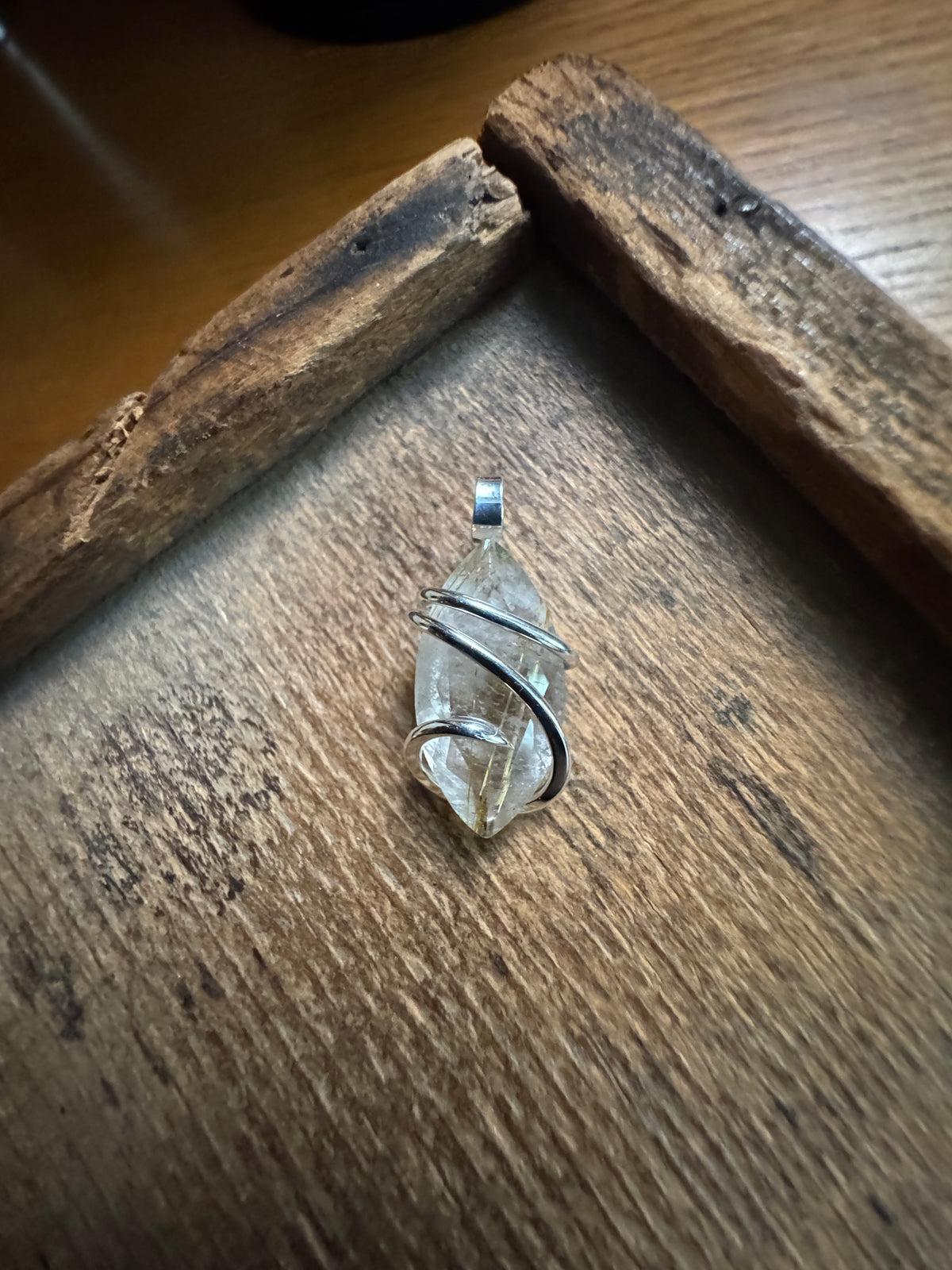 Faceted rutilated quartz in sterling silver pendant