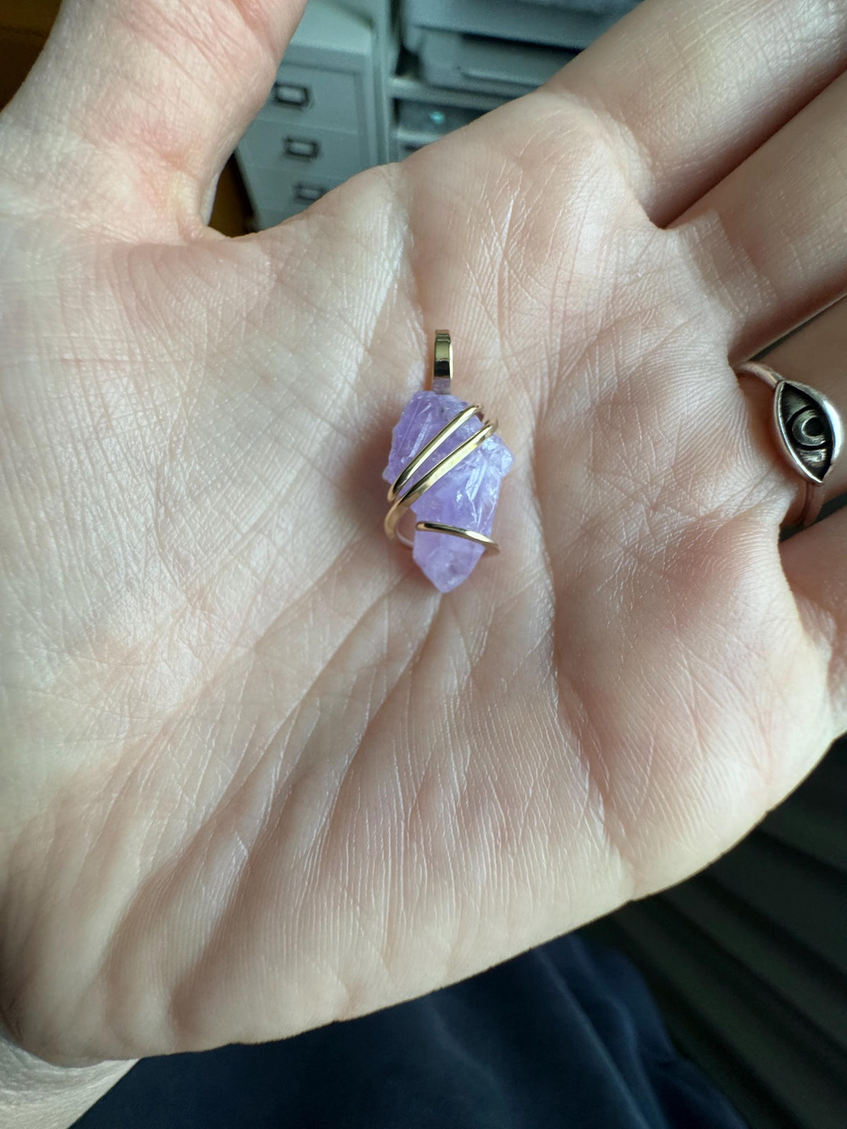 Apatite crystal in forged 14k gold pendant