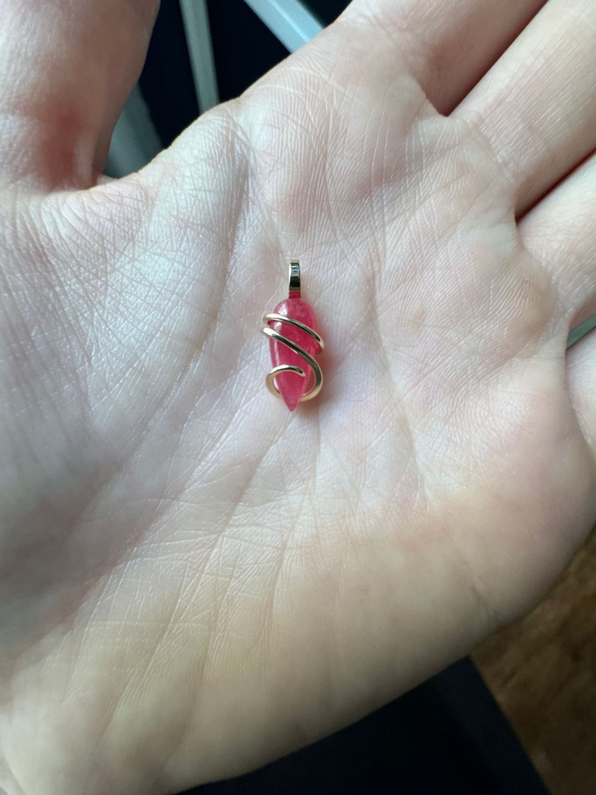 Faceted rhodonite in 14k gold pendant