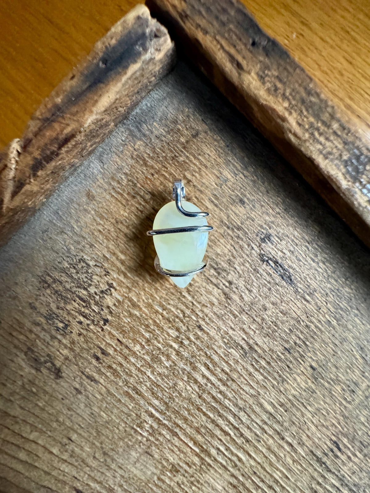 Yellow opal set in forged sterling silver pendant