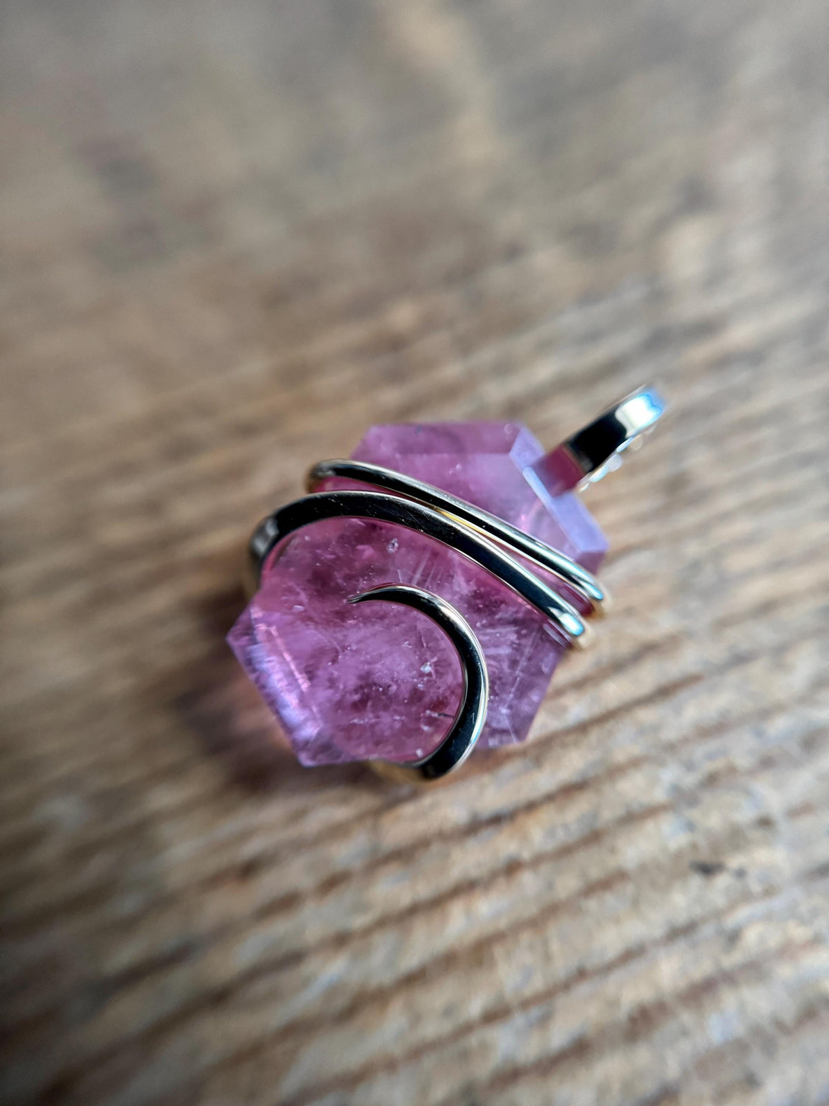 Faceted ruby set in 14kt gold pendant