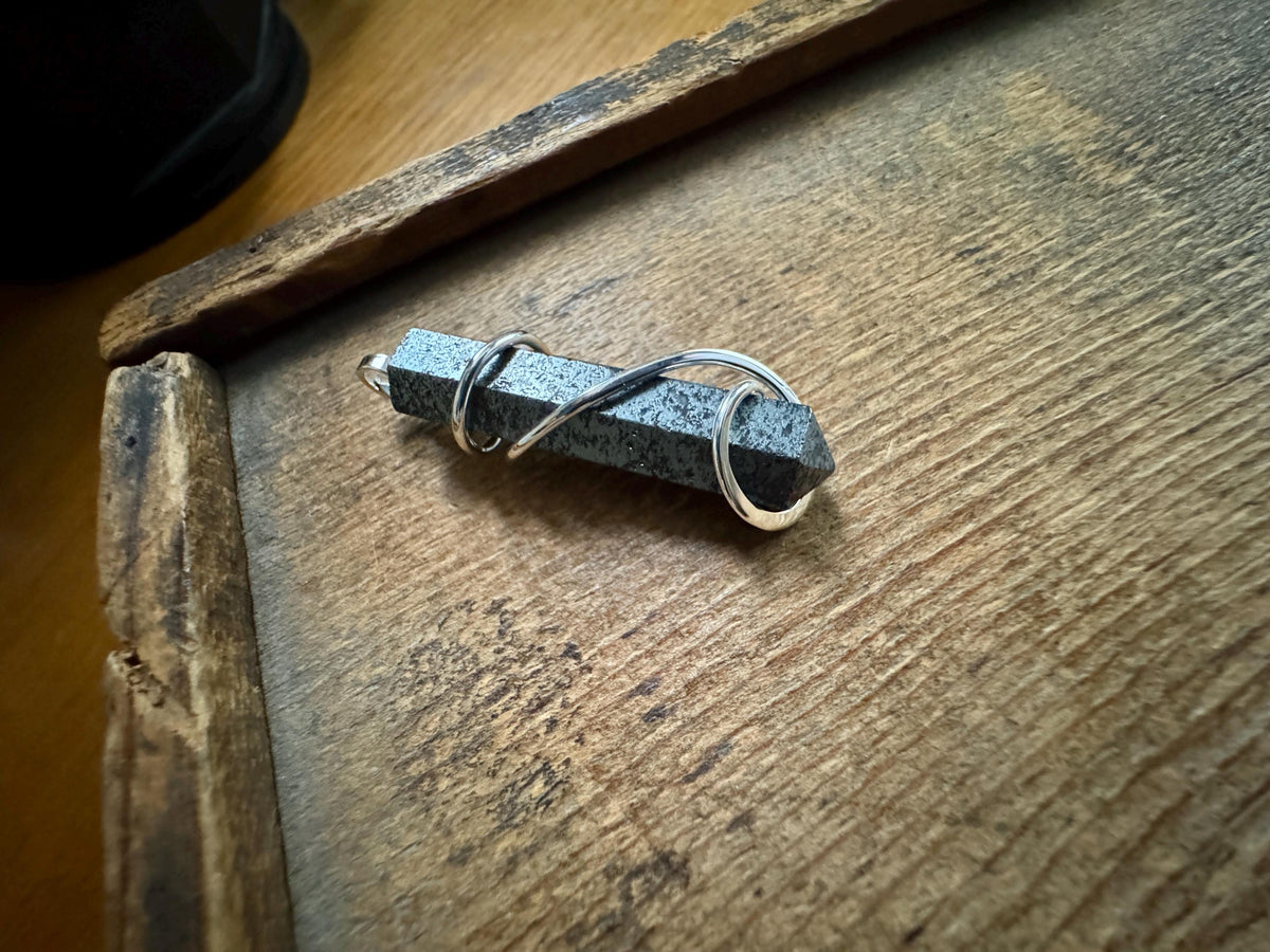 Hematite point in sterling silver pendant