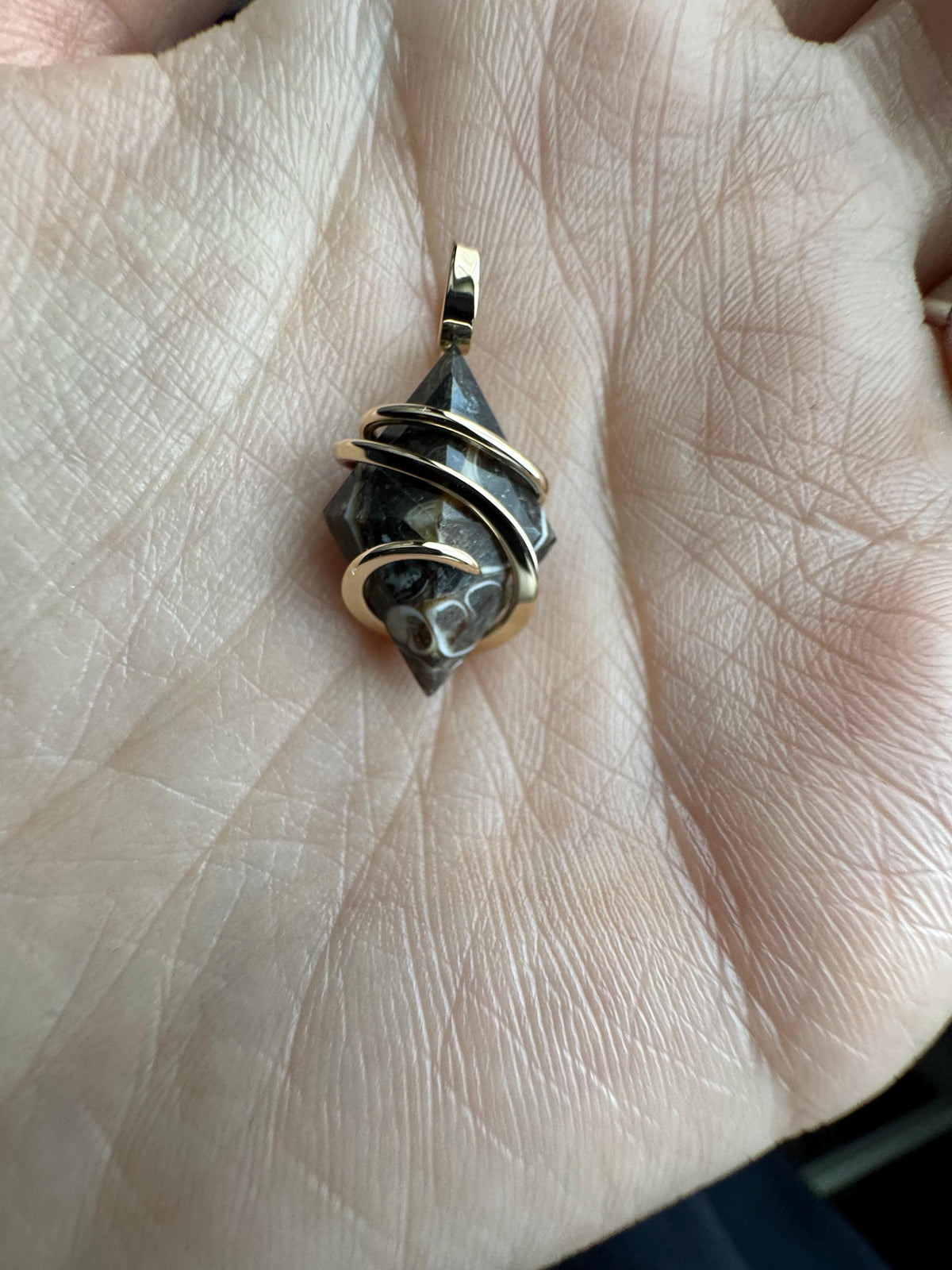 Faceted turritella agate in 14k gold pendant