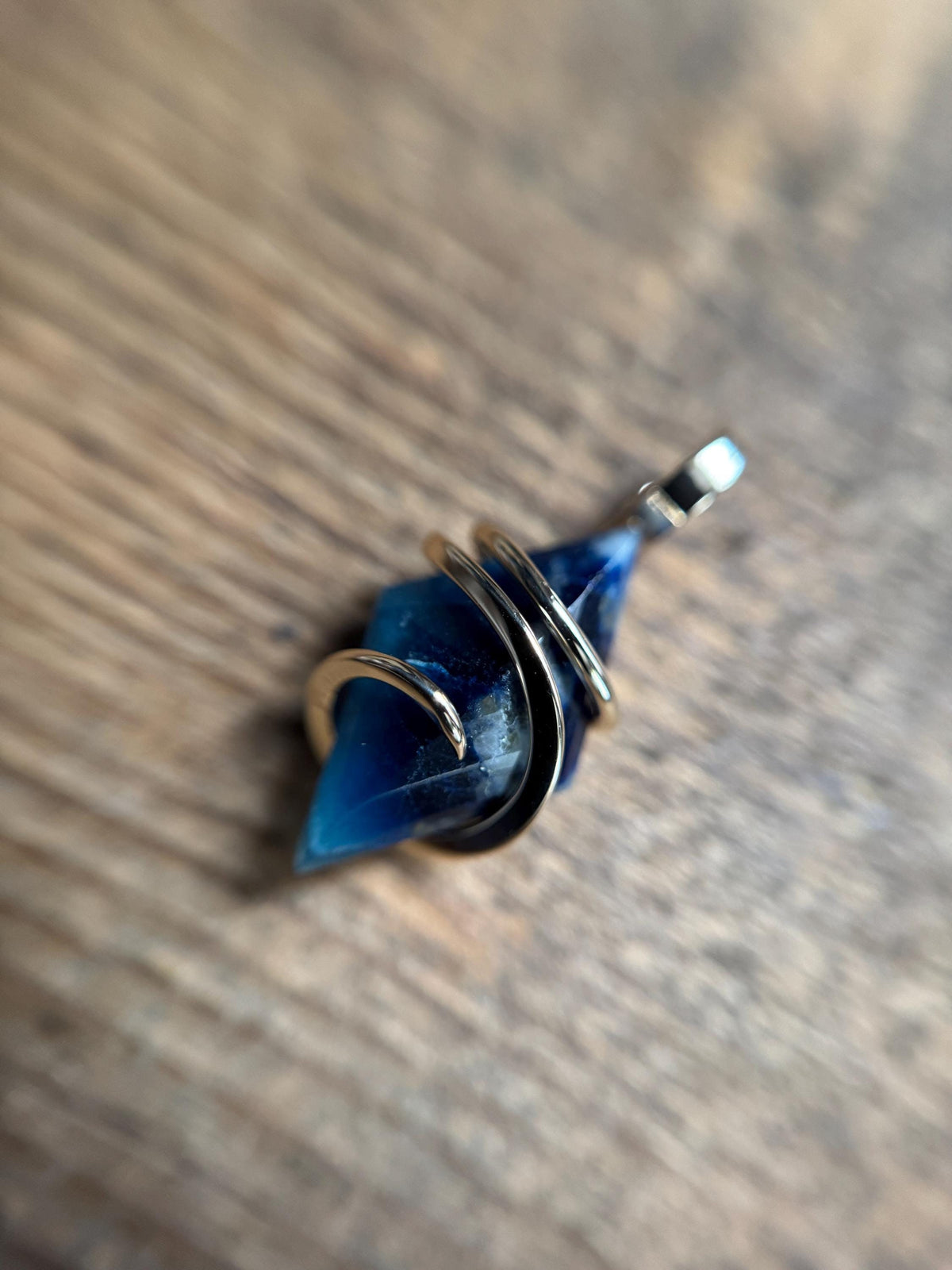 Faceted afghanite in 14k gold pendant