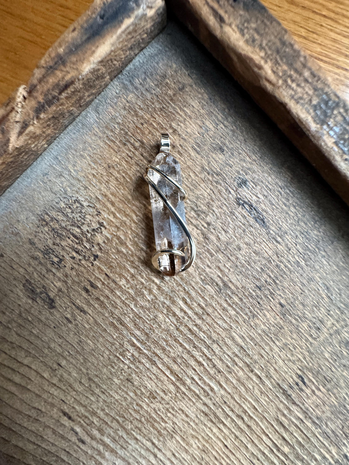 Topaz crystal in 14k gold pendant