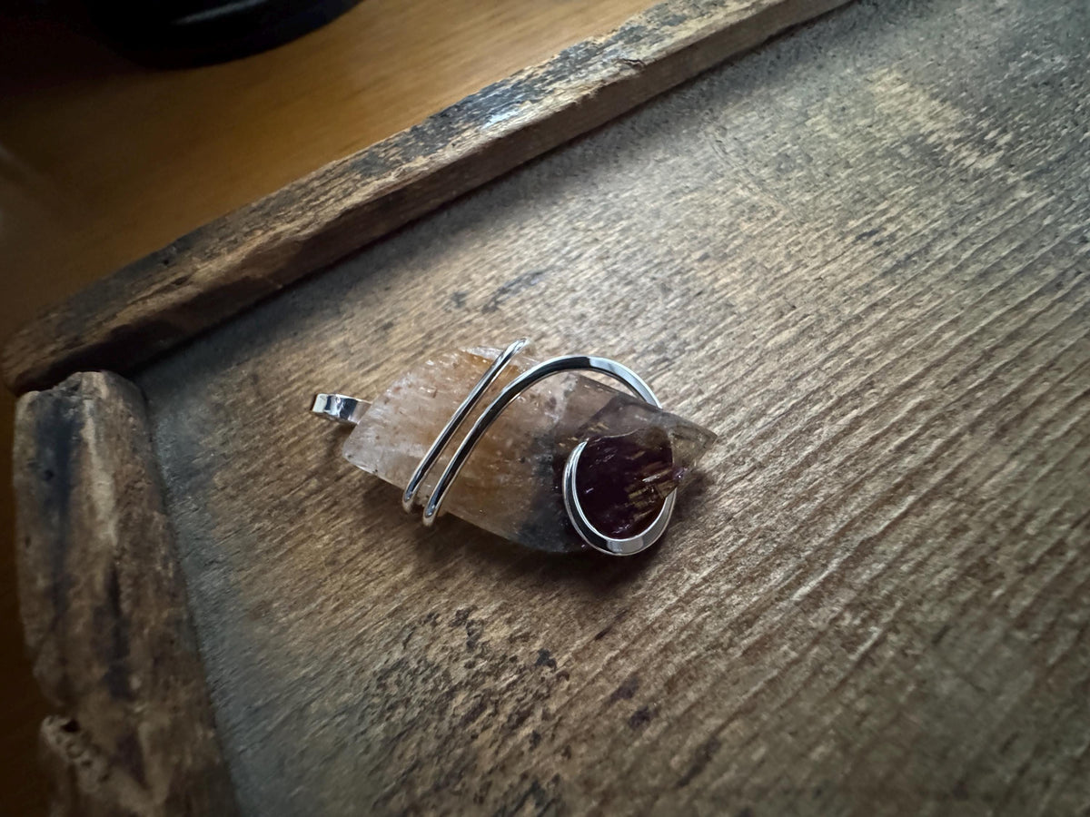 Faceted super seven in sterling silver pendant