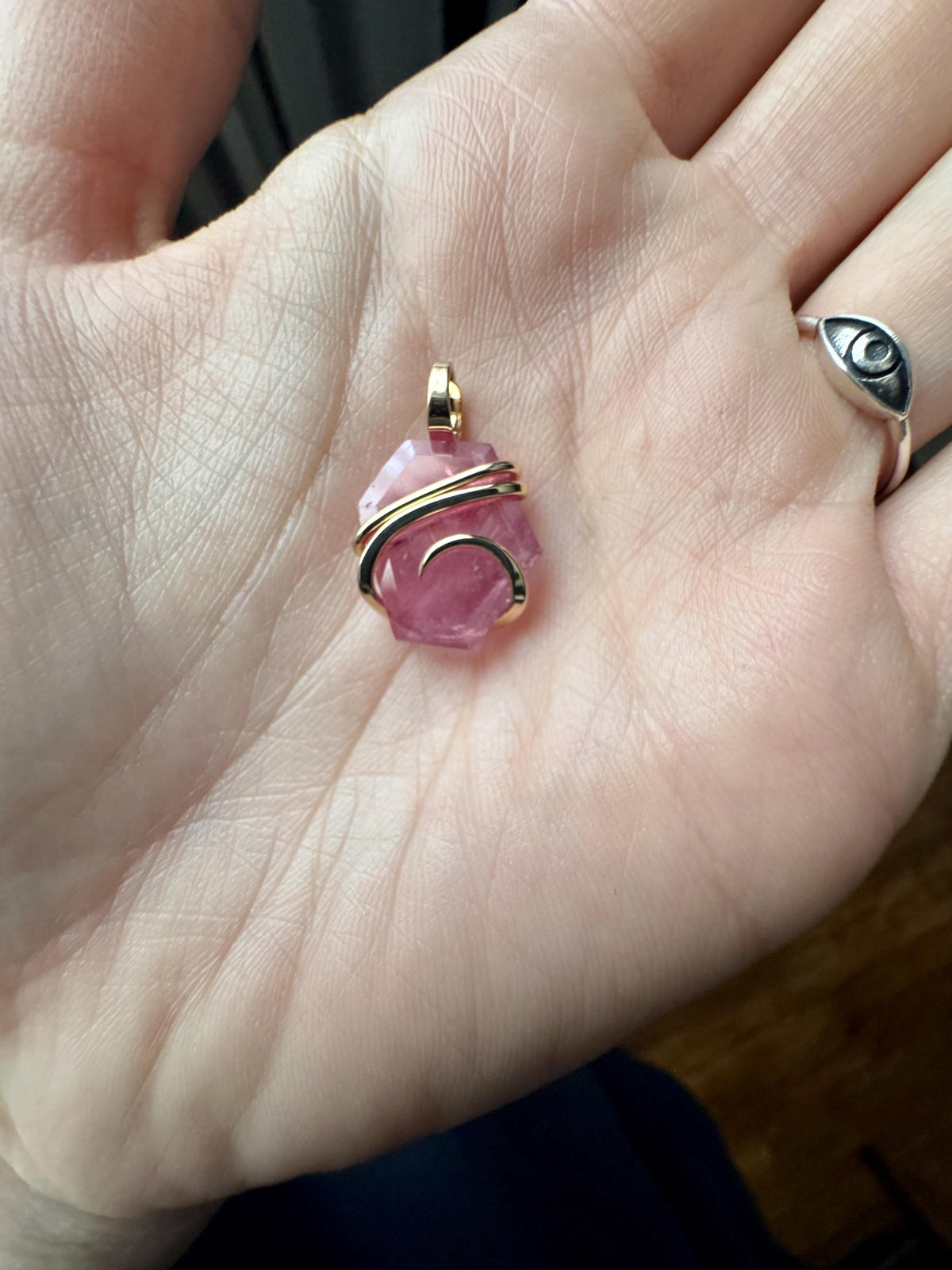 Faceted ruby set in 14kt gold pendant