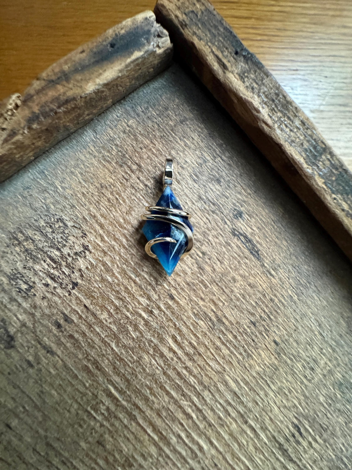 Faceted afghanite in 14k gold pendant