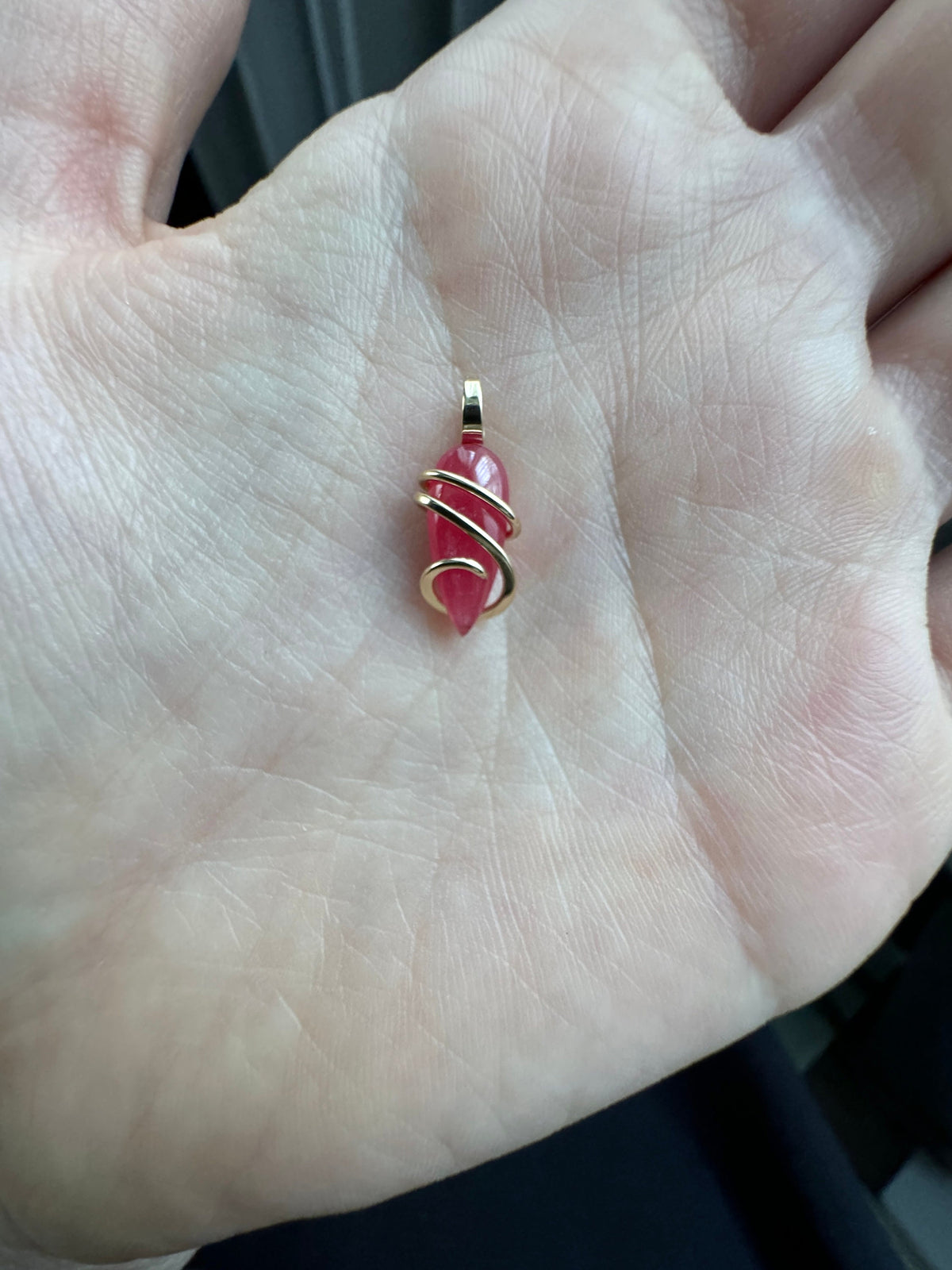 Faceted rhodonite in 14k gold pendant