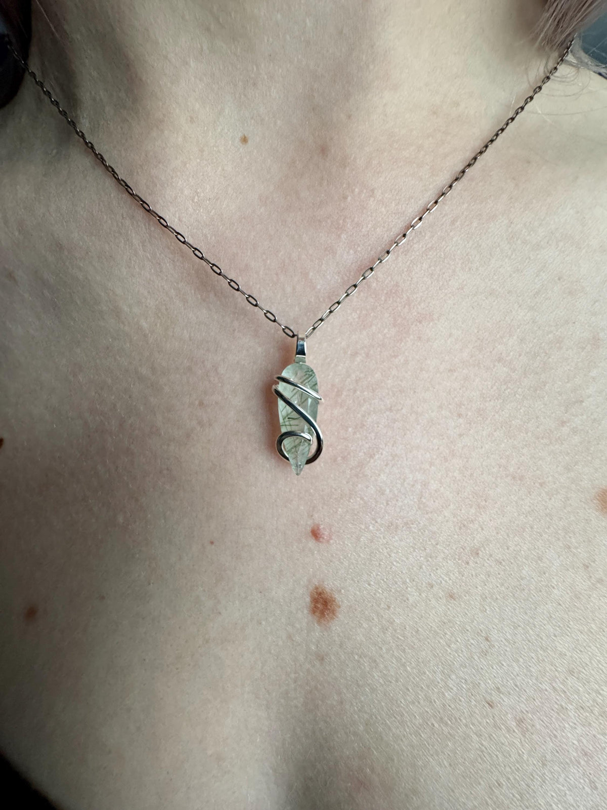 Faceted tourmalinated quartz in sterling silver pendant