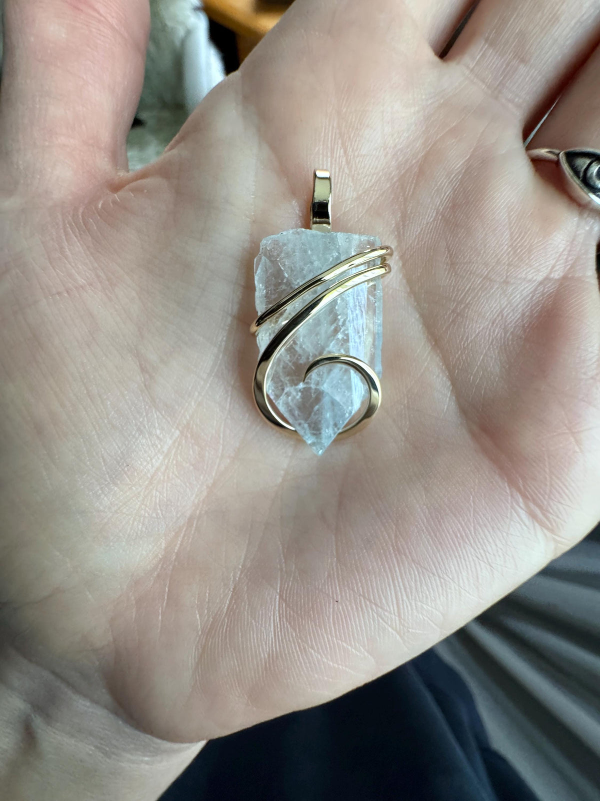 Blue celestite crystal in 14k gold pendant