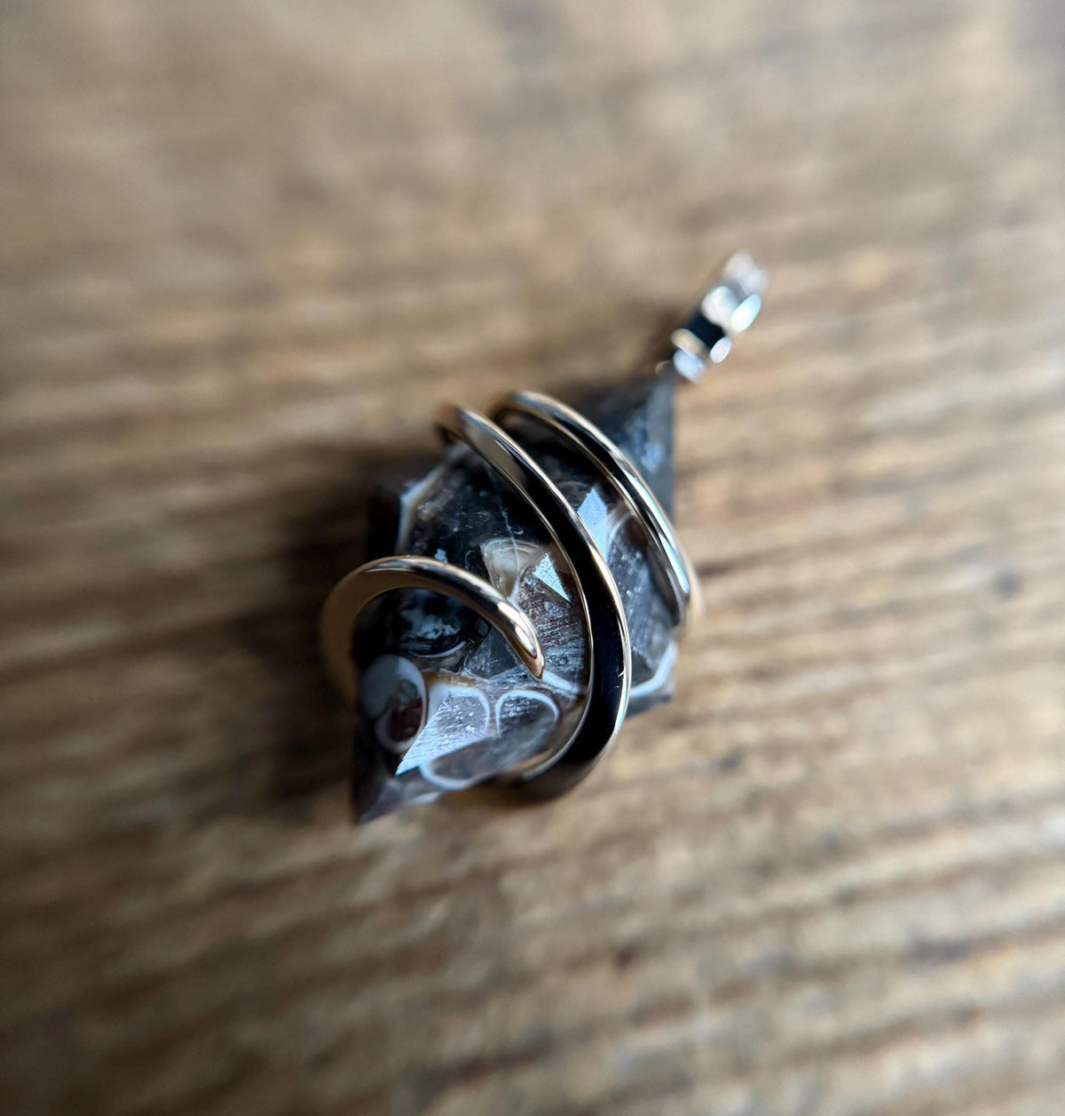 Faceted turritella agate in 14k gold pendant