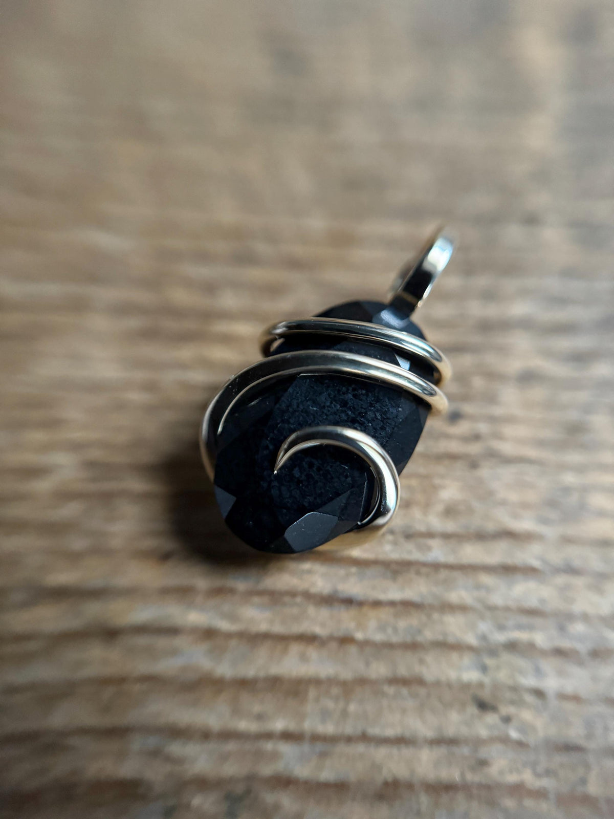 Faceted black tourmaline in 14k gold pendant