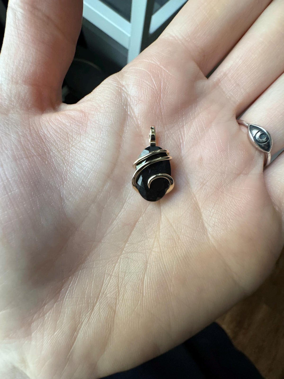 Faceted black tourmaline in 14k gold pendant
