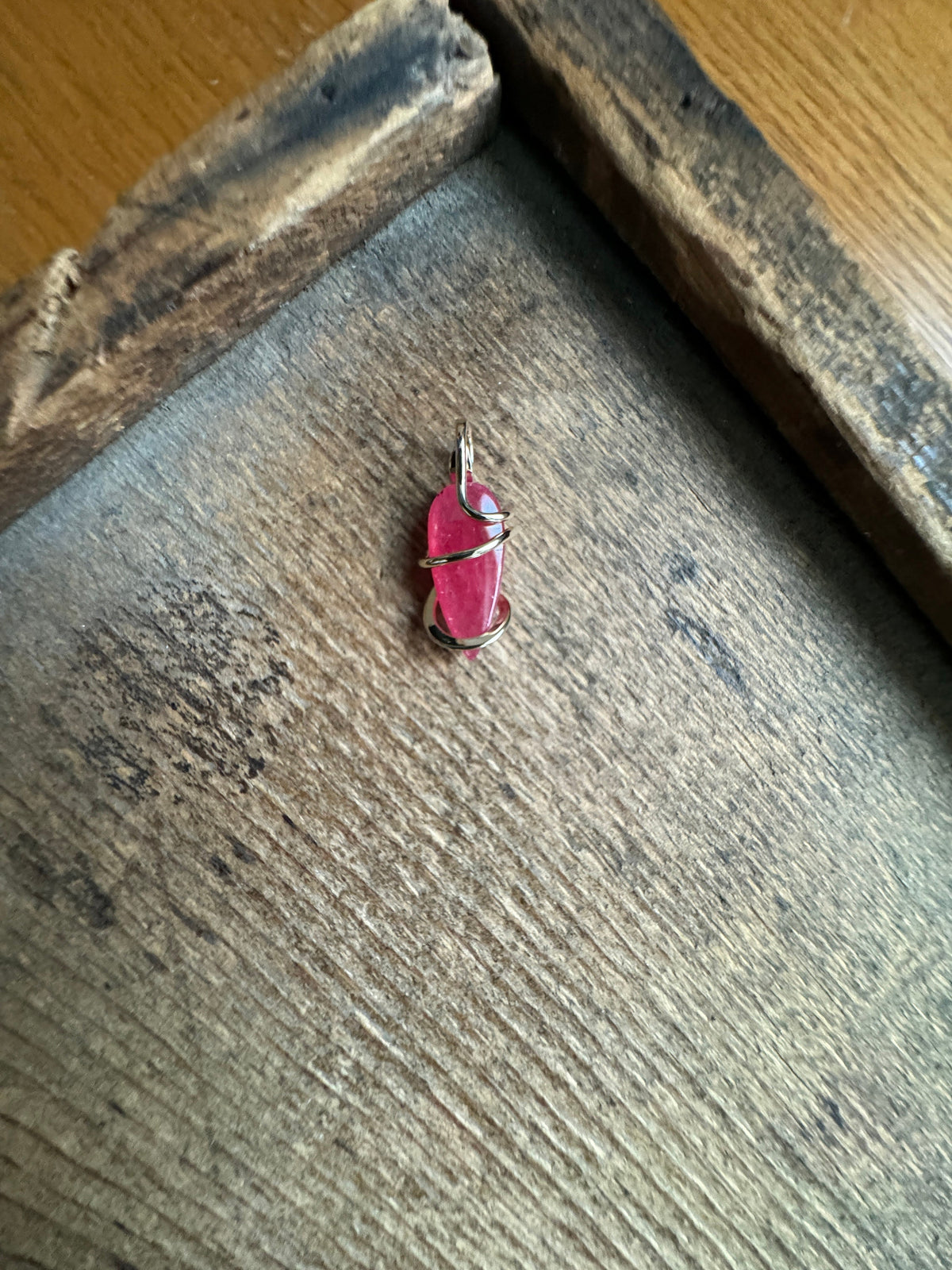 Faceted rhodonite in 14k gold pendant