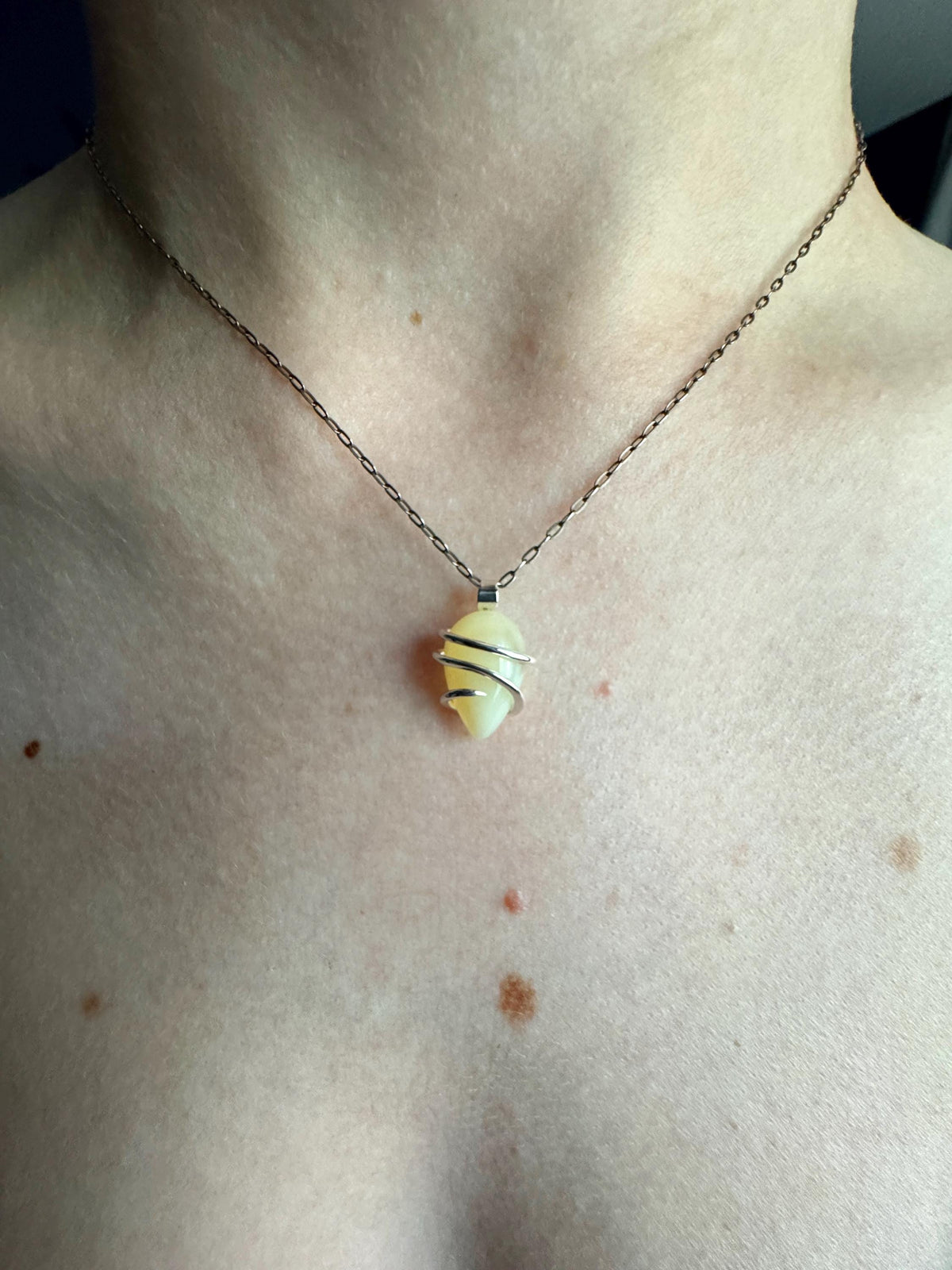 Yellow opal set in forged sterling silver pendant