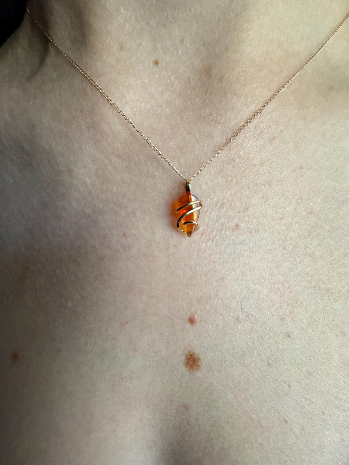 Fire opal in 14k gold pendant