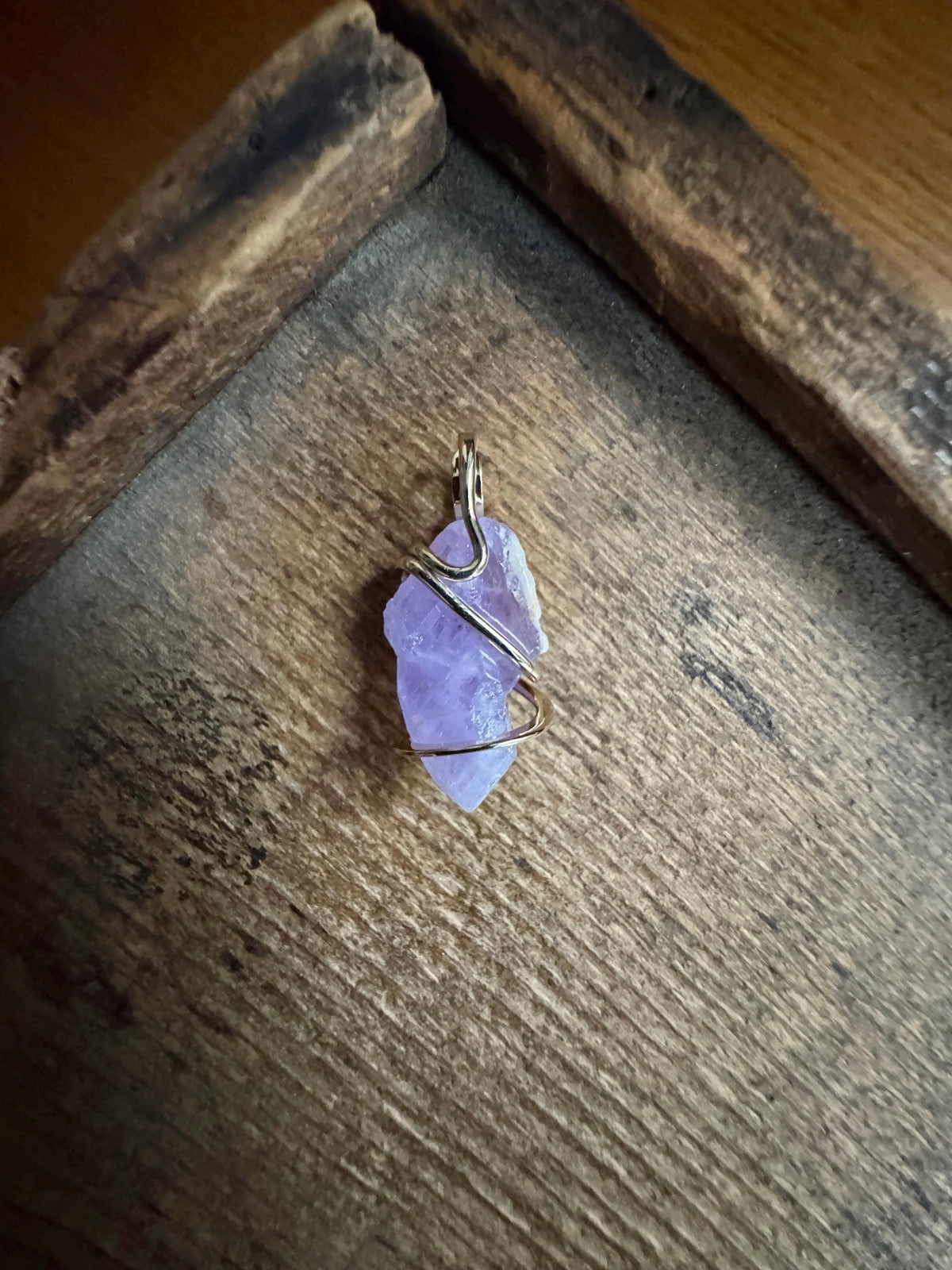 Apatite crystal in forged 14k gold pendant