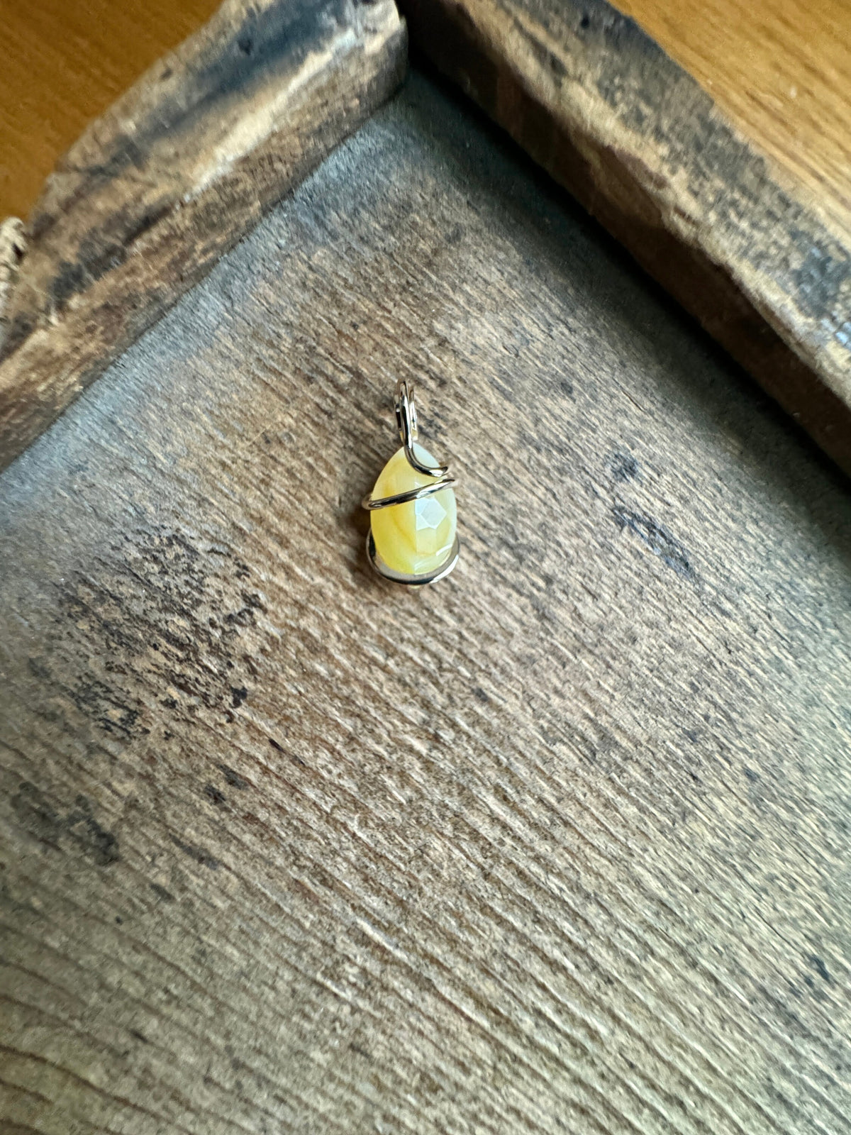 Faceted smithsonite in 14k gold pendant