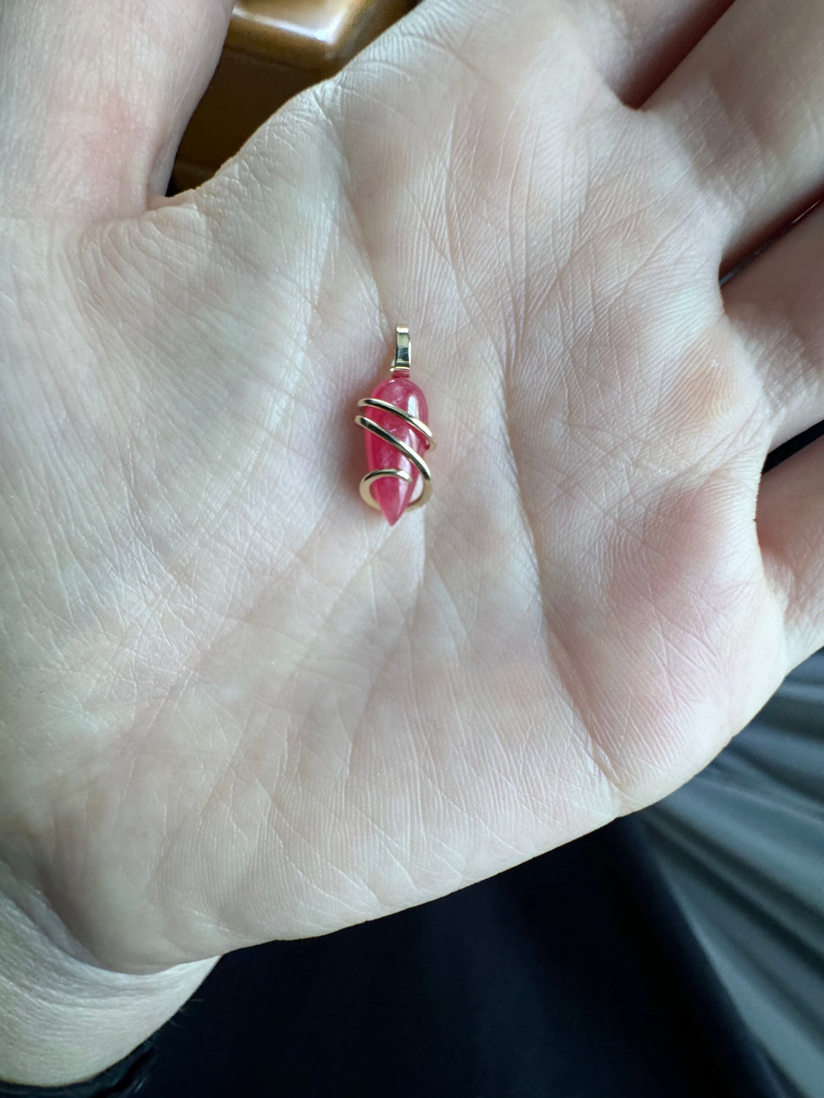 Faceted rhodonite in 14k gold pendant