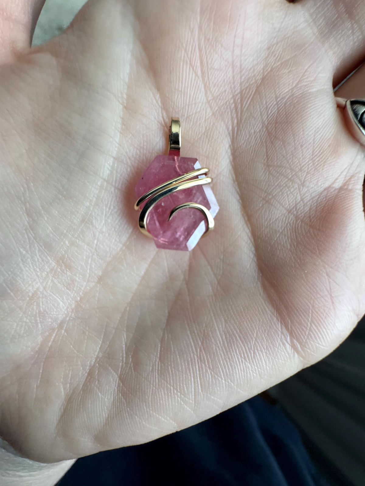 Faceted ruby set in 14kt gold pendant