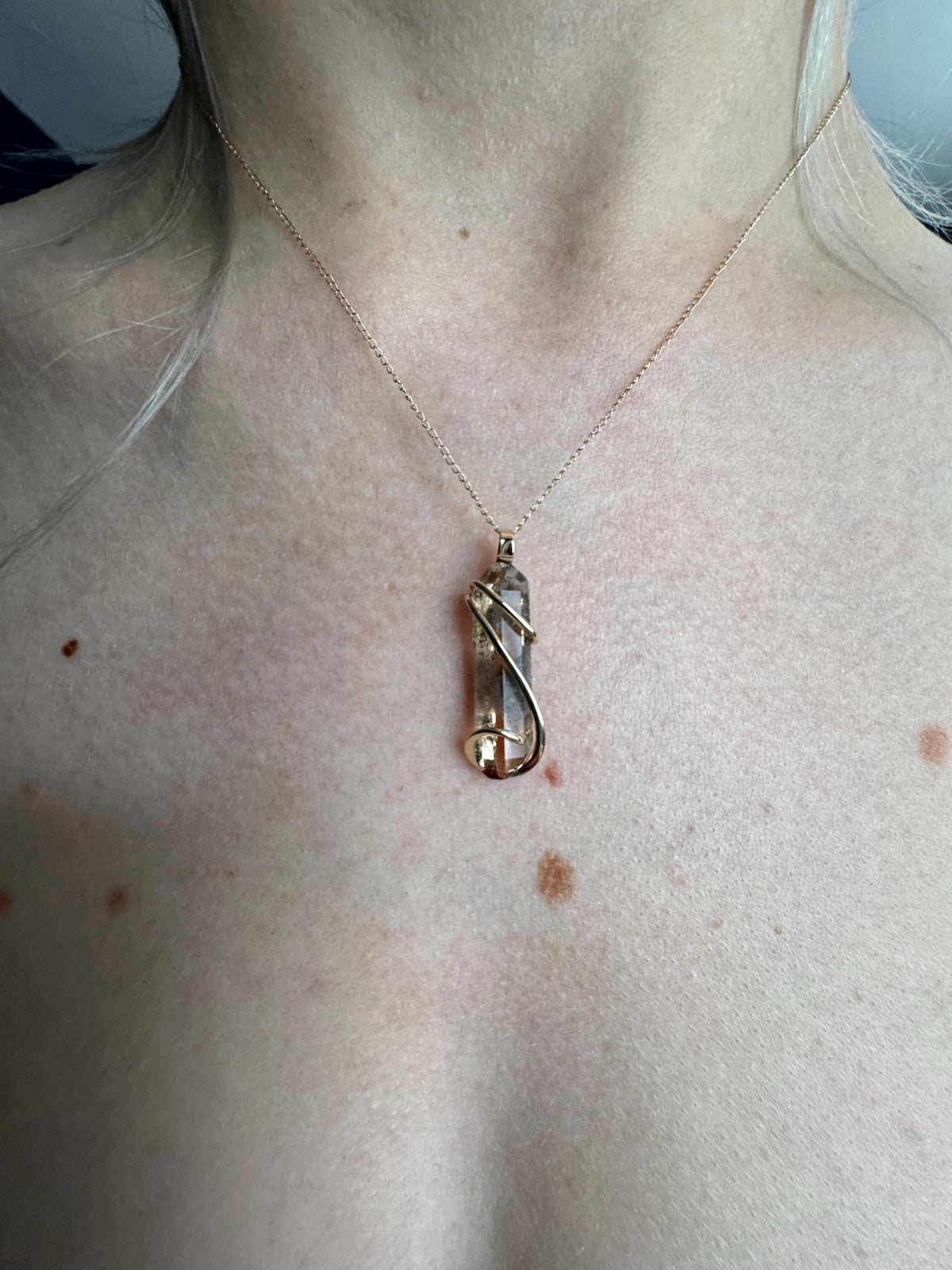 Topaz crystal in 14k gold pendant