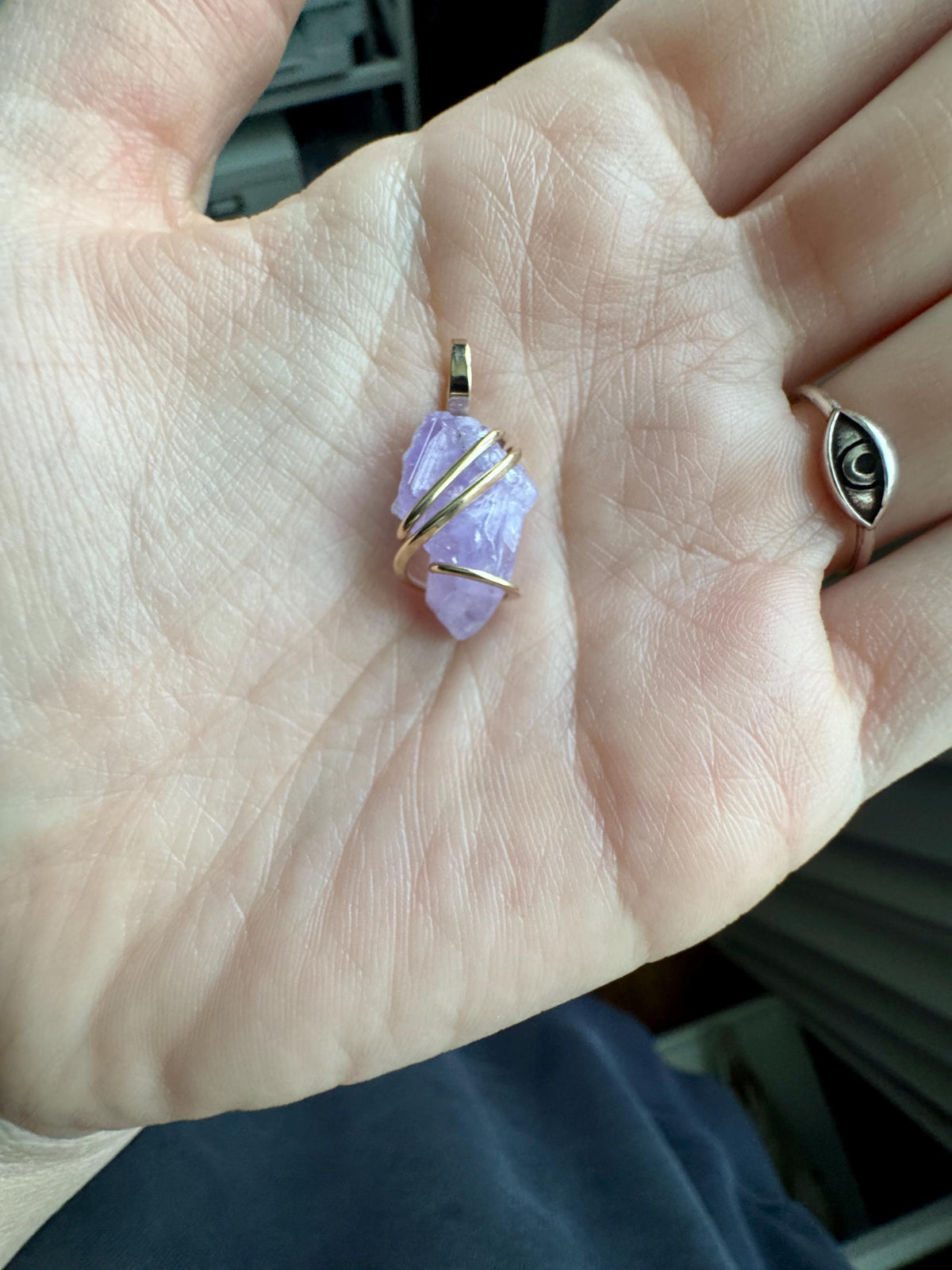 Apatite crystal in forged 14k gold pendant