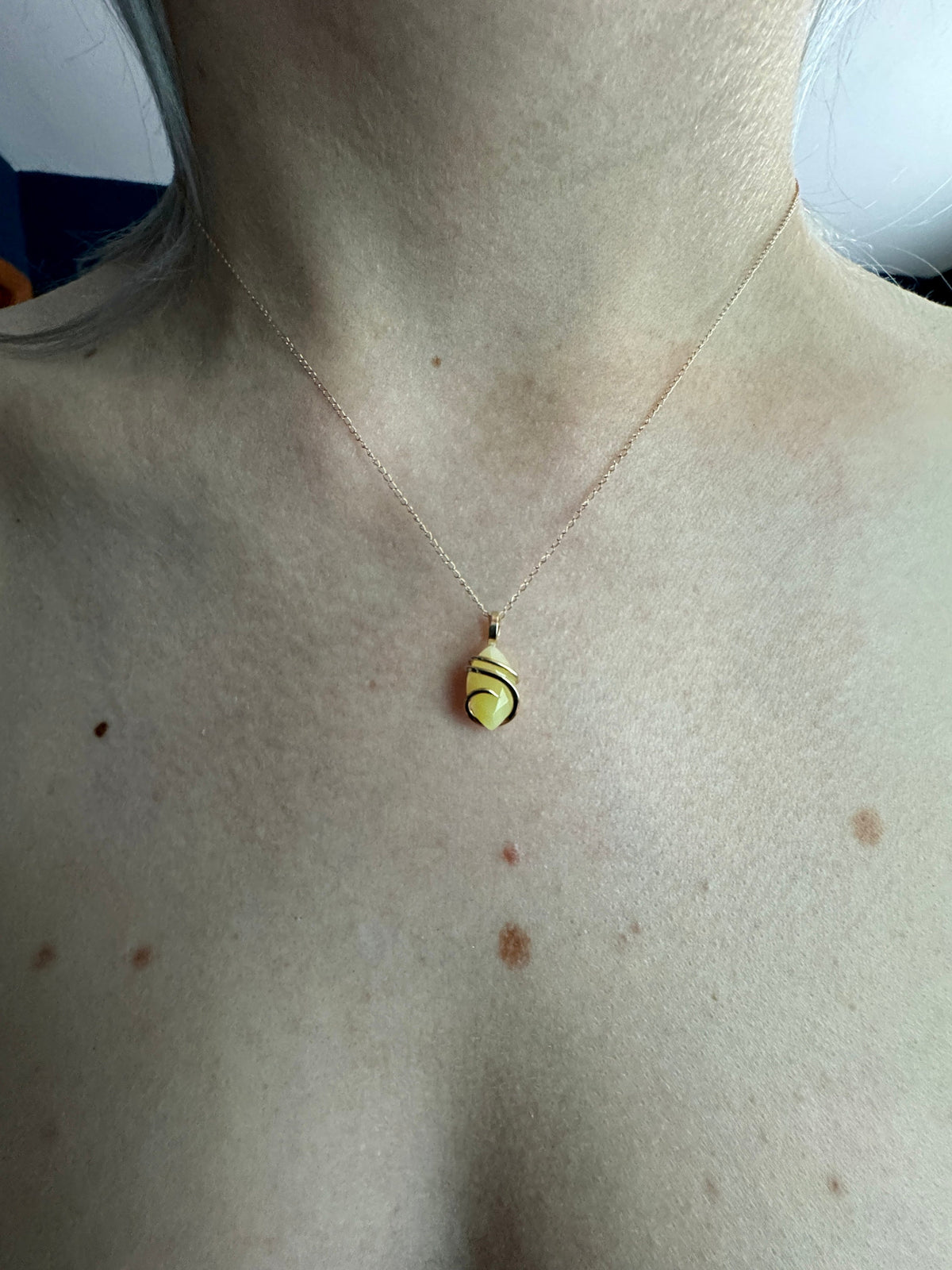 Faceted smithsonite in 14k gold pendant