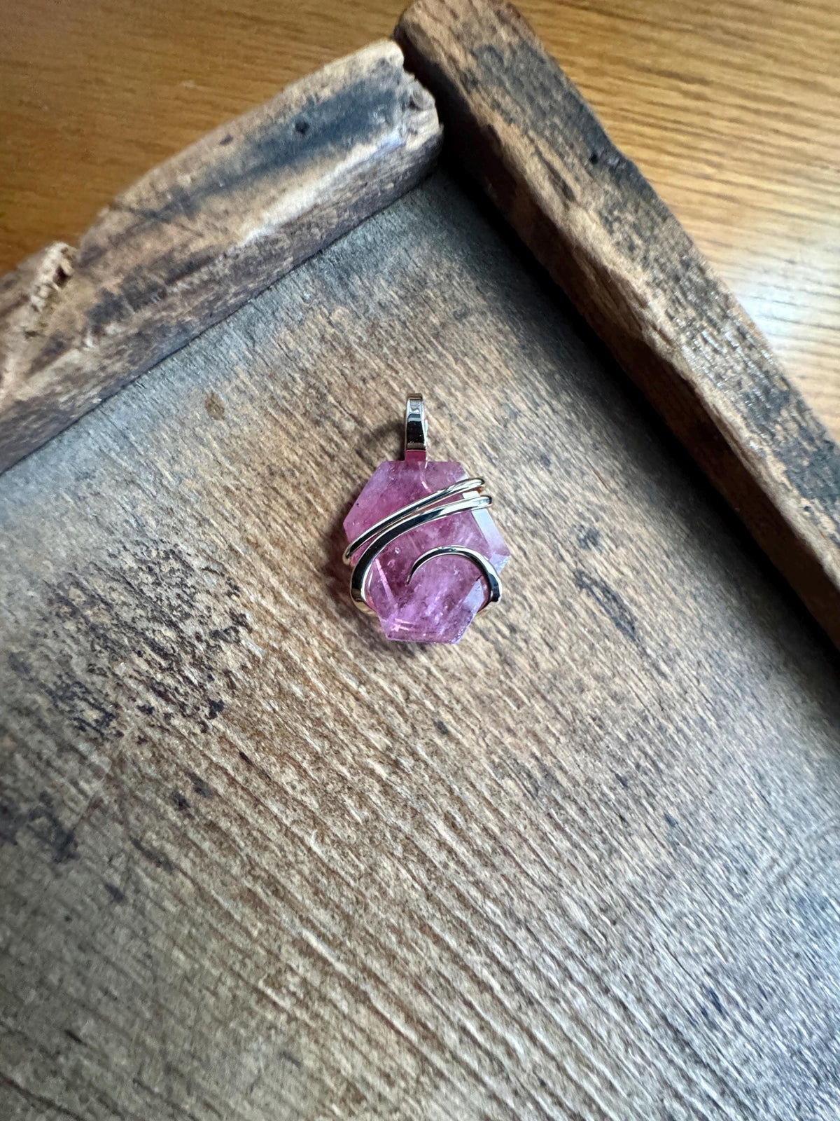Faceted ruby set in 14kt gold pendant