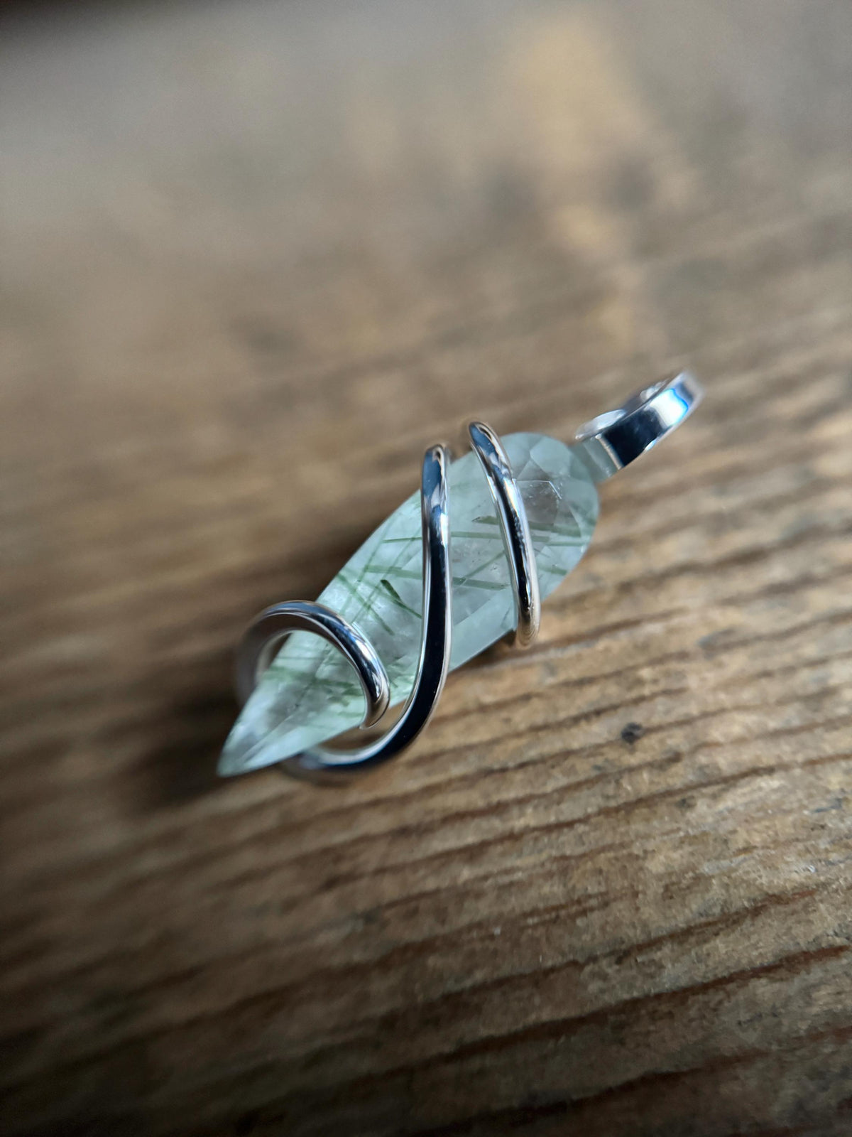 Faceted tourmalinated quartz in sterling silver pendant