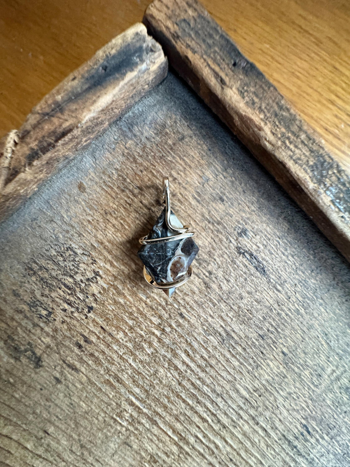 Faceted turritella agate in 14k gold pendant