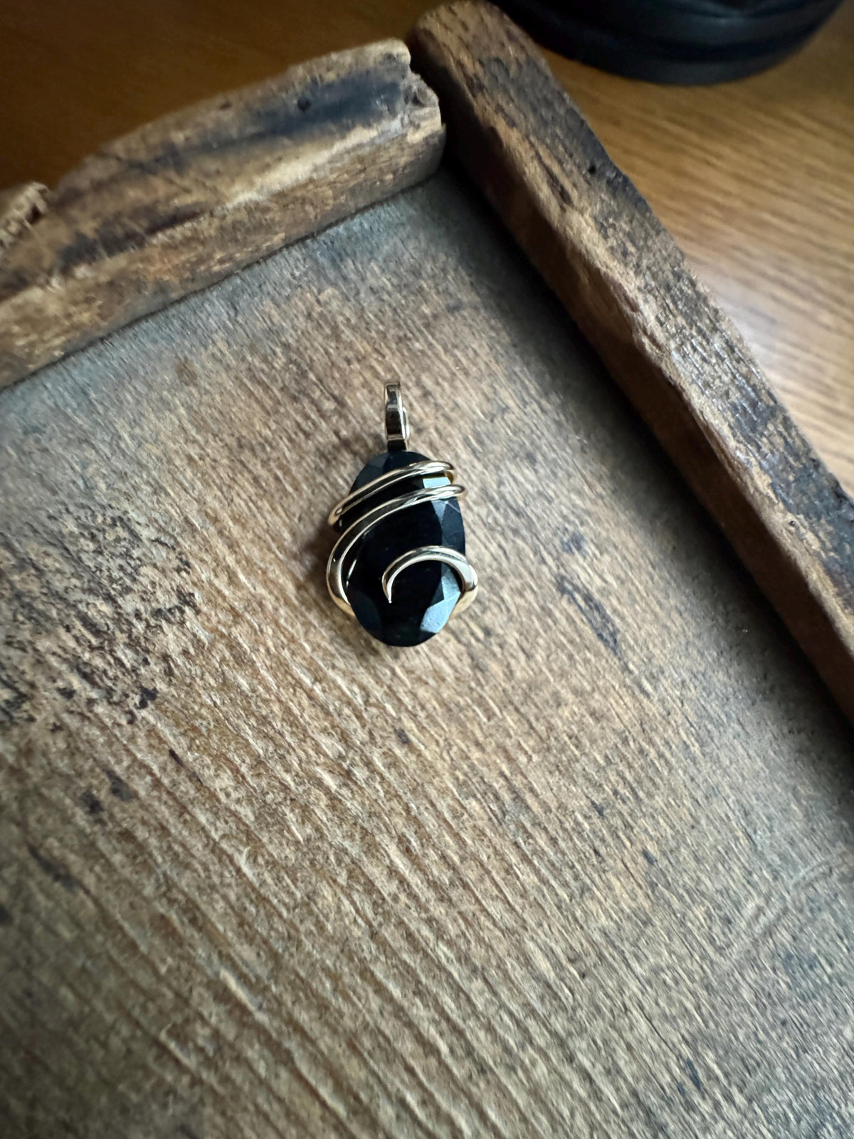 Faceted black tourmaline in 14k gold pendant