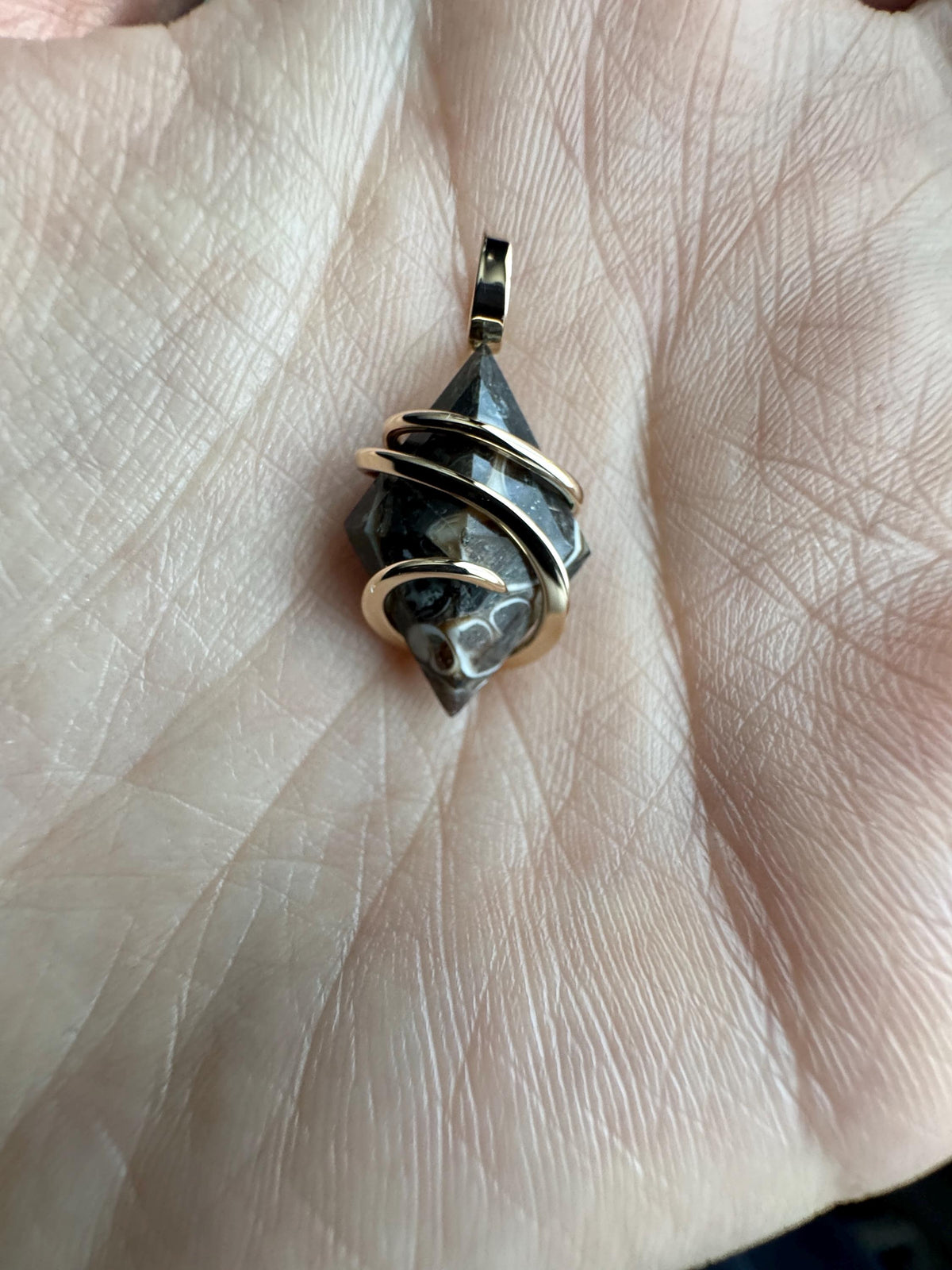Faceted turritella agate in 14k gold pendant
