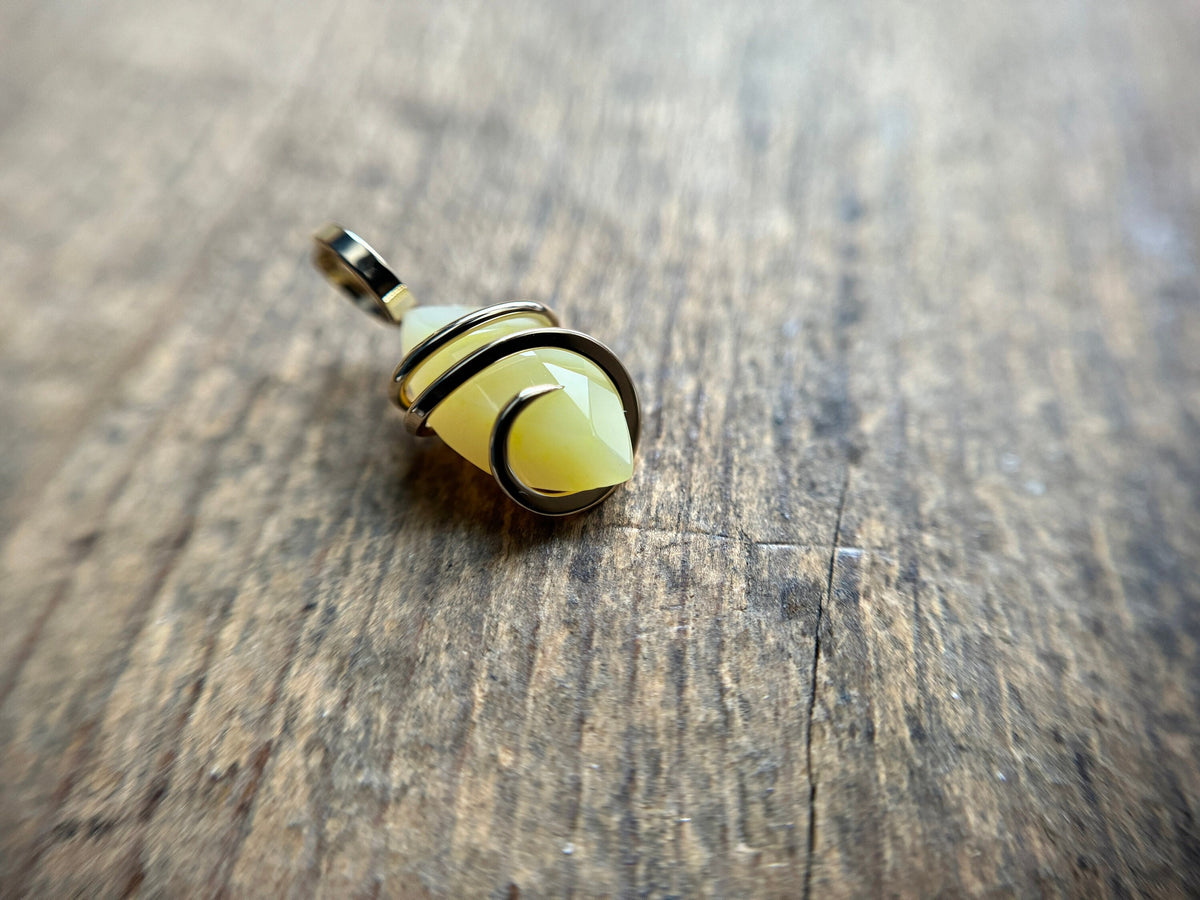 Faceted smithsonite in 14k gold pendant