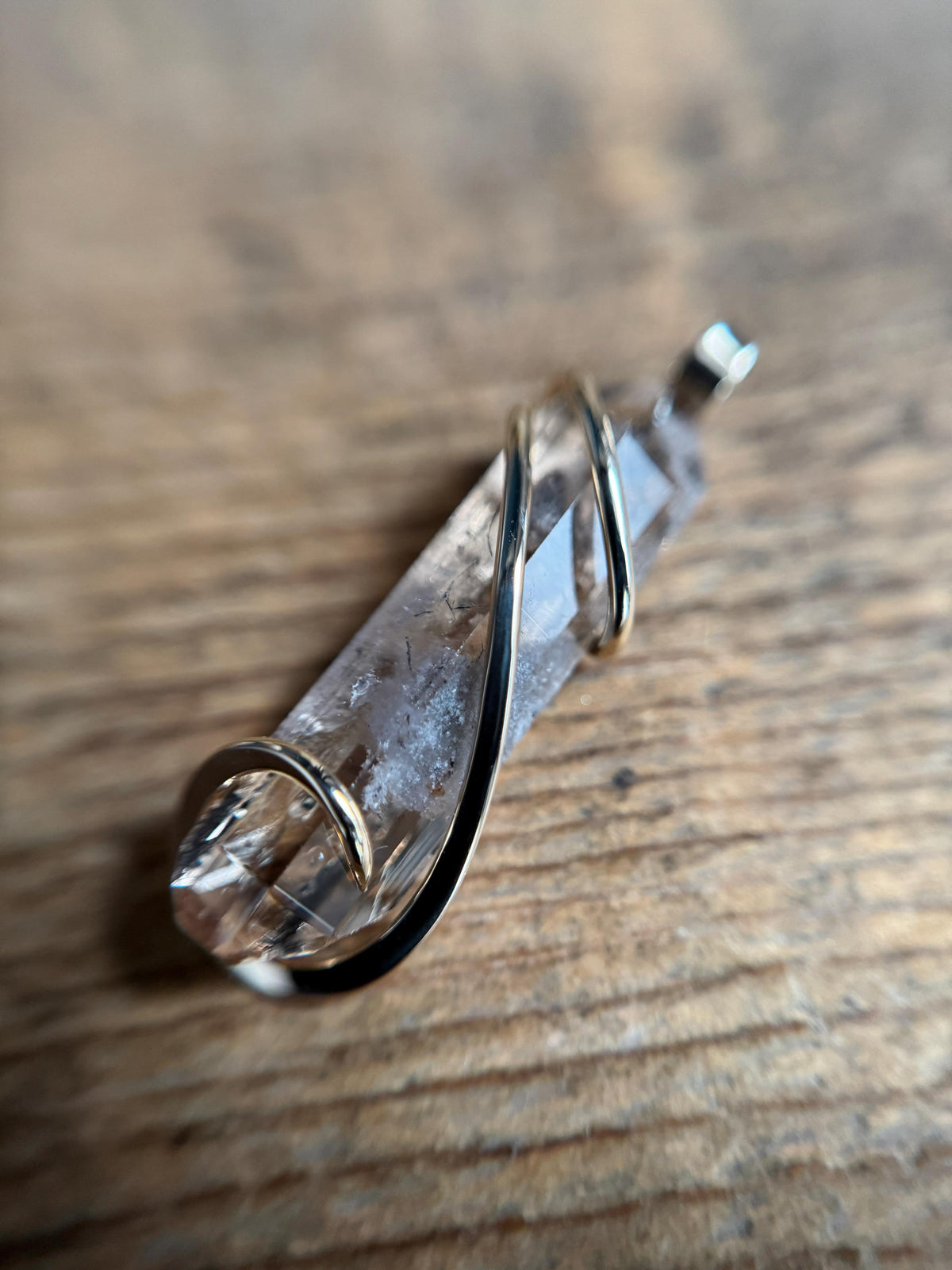 Topaz crystal in 14k gold pendant