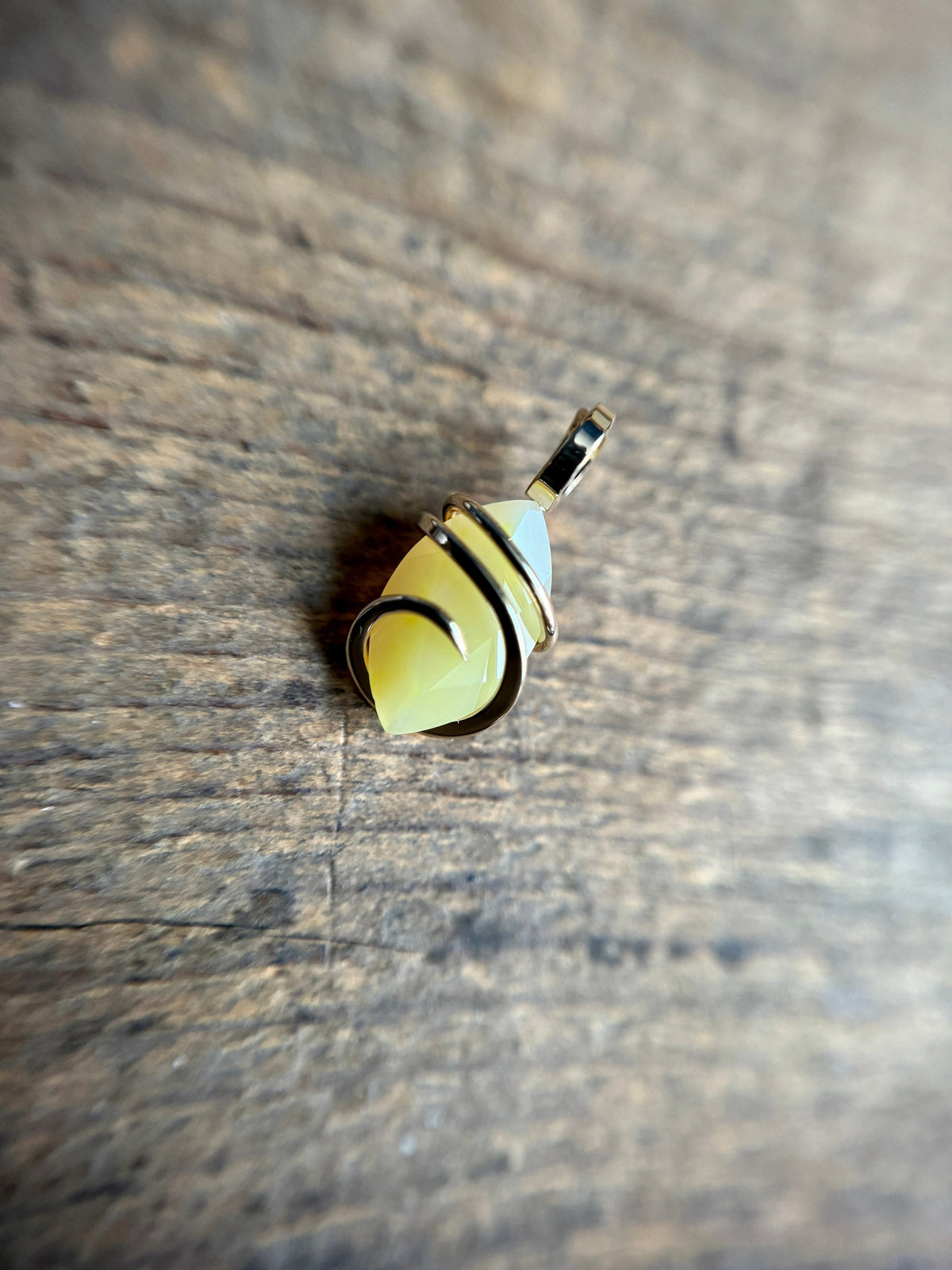 Faceted smithsonite in 14k gold pendant
