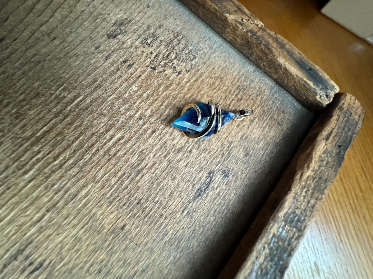 Faceted afghanite in 14k gold pendant