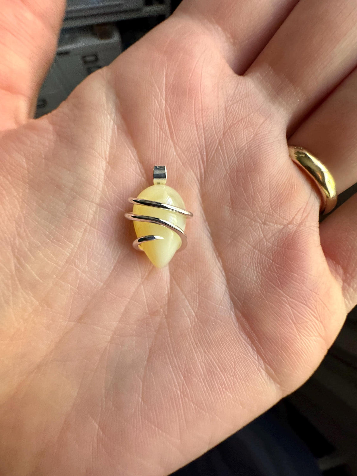Yellow opal set in forged sterling silver pendant