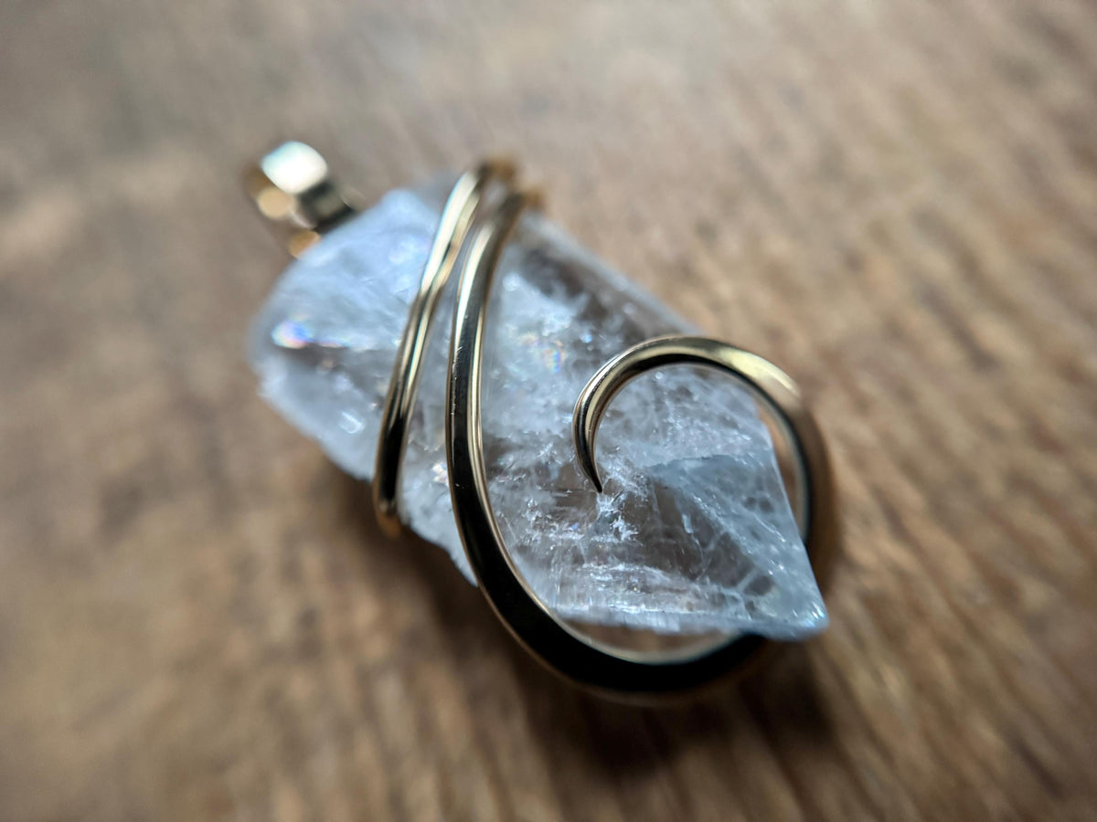 Blue celestite crystal in 14k gold pendant