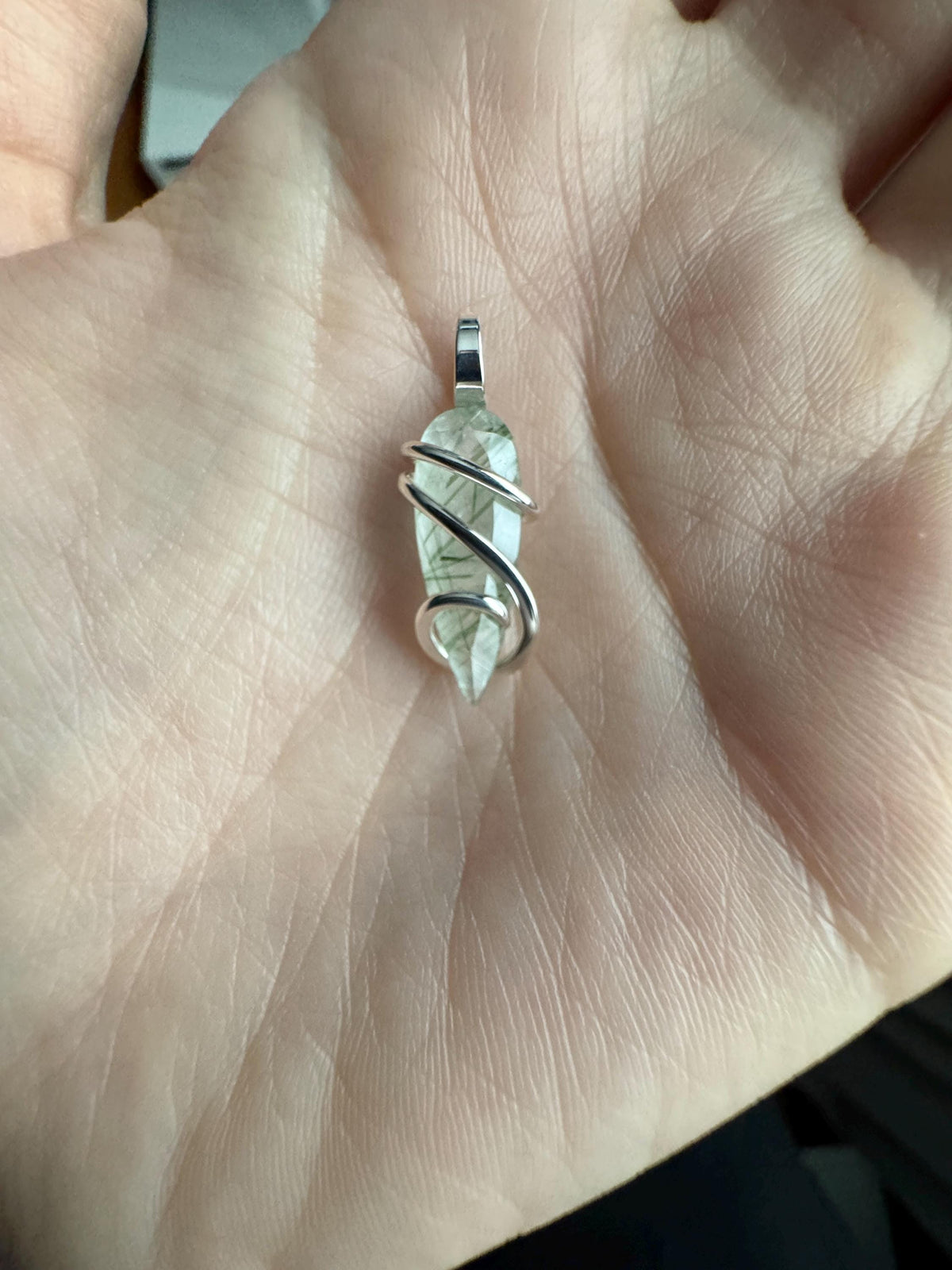 Faceted tourmalinated quartz in sterling silver pendant