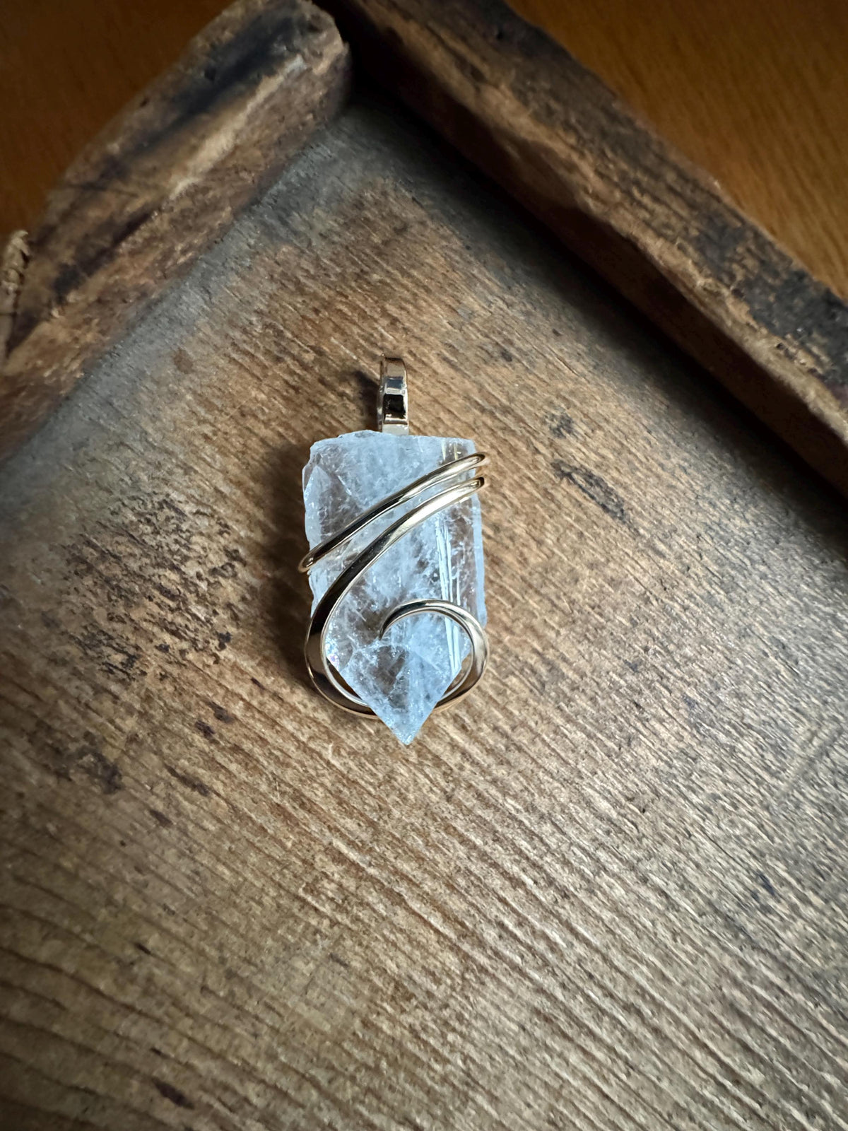 Blue celestite crystal in 14k gold pendant