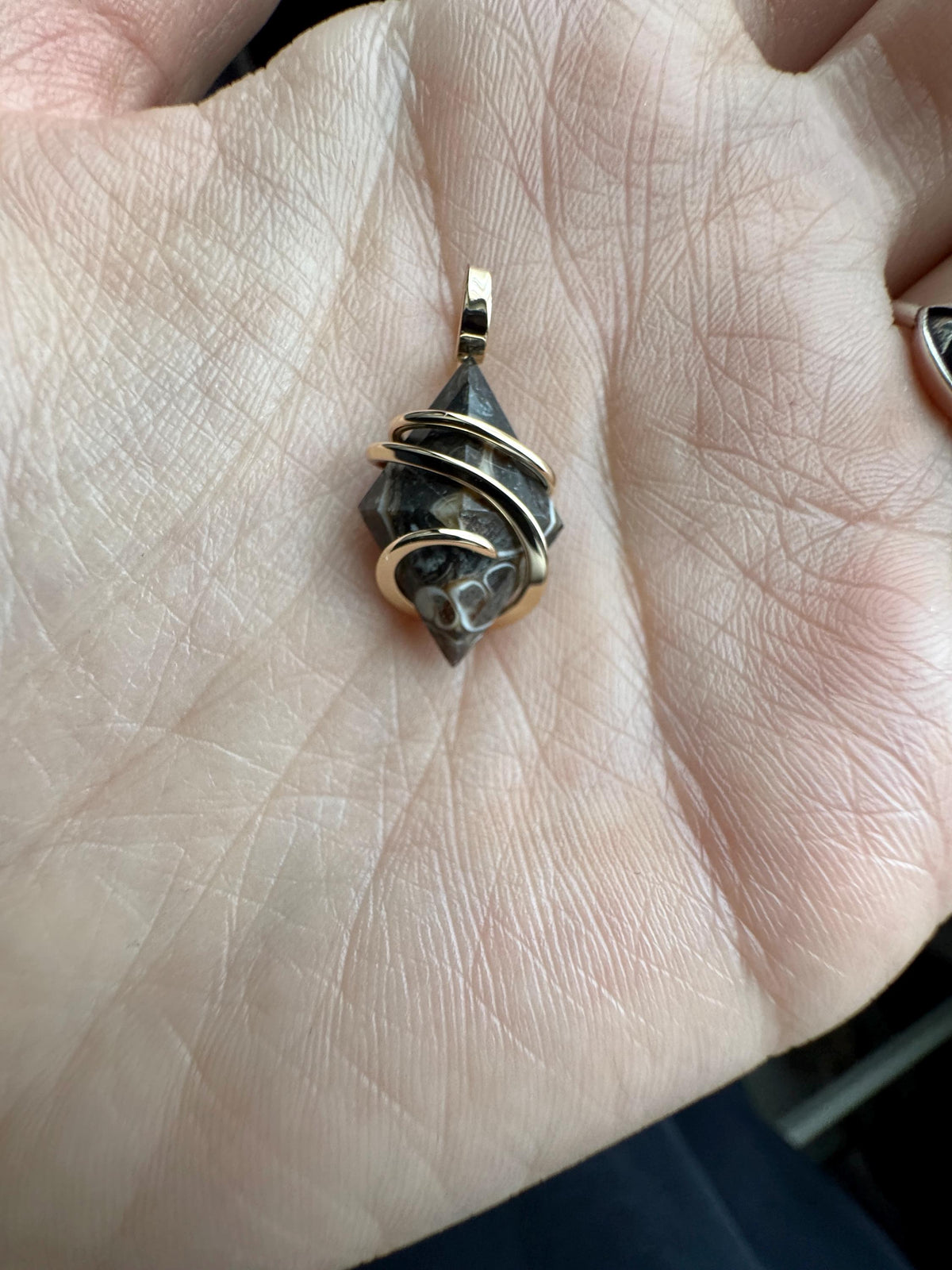 Faceted turritella agate in 14k gold pendant