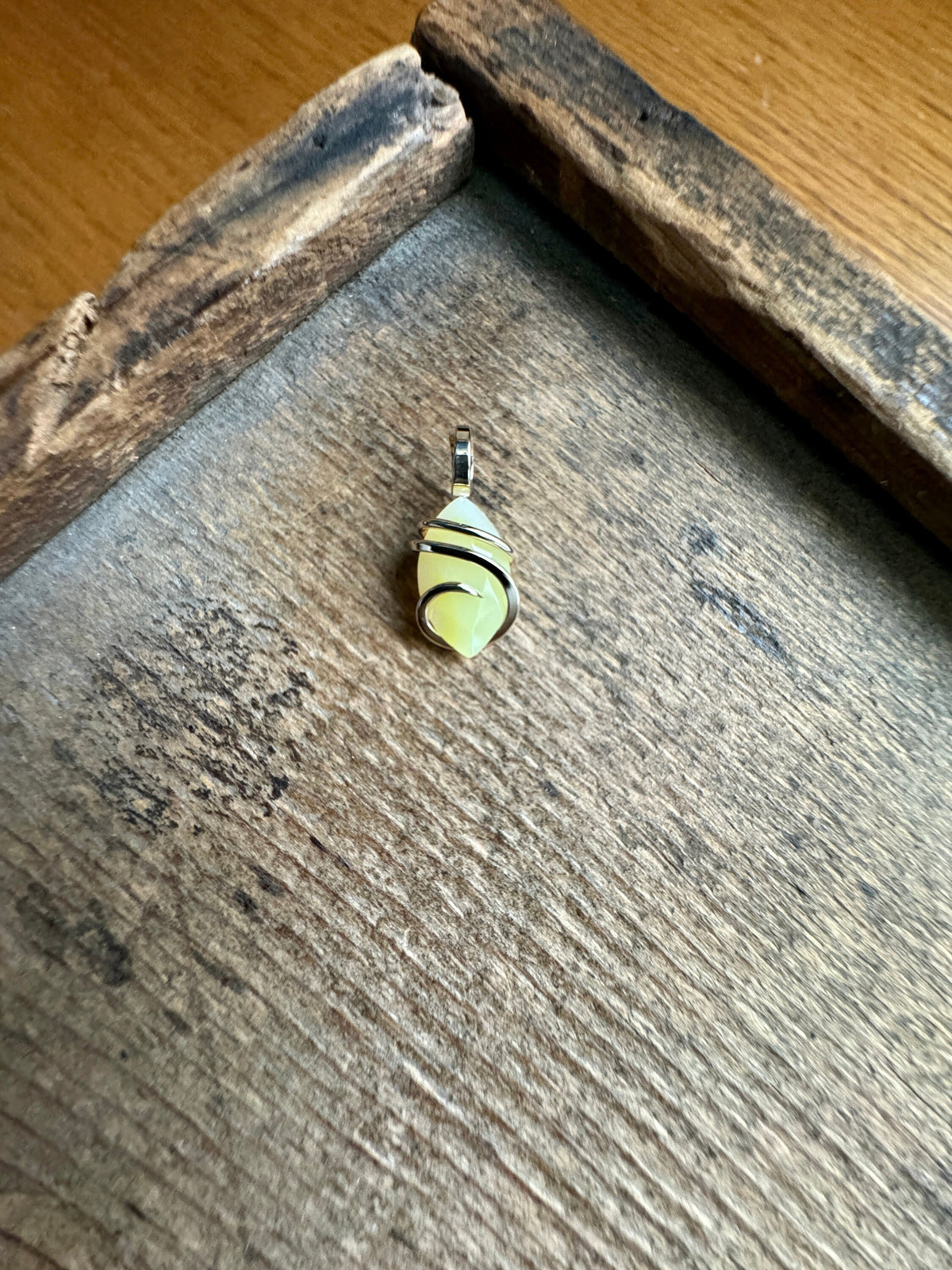 Faceted smithsonite in 14k gold pendant