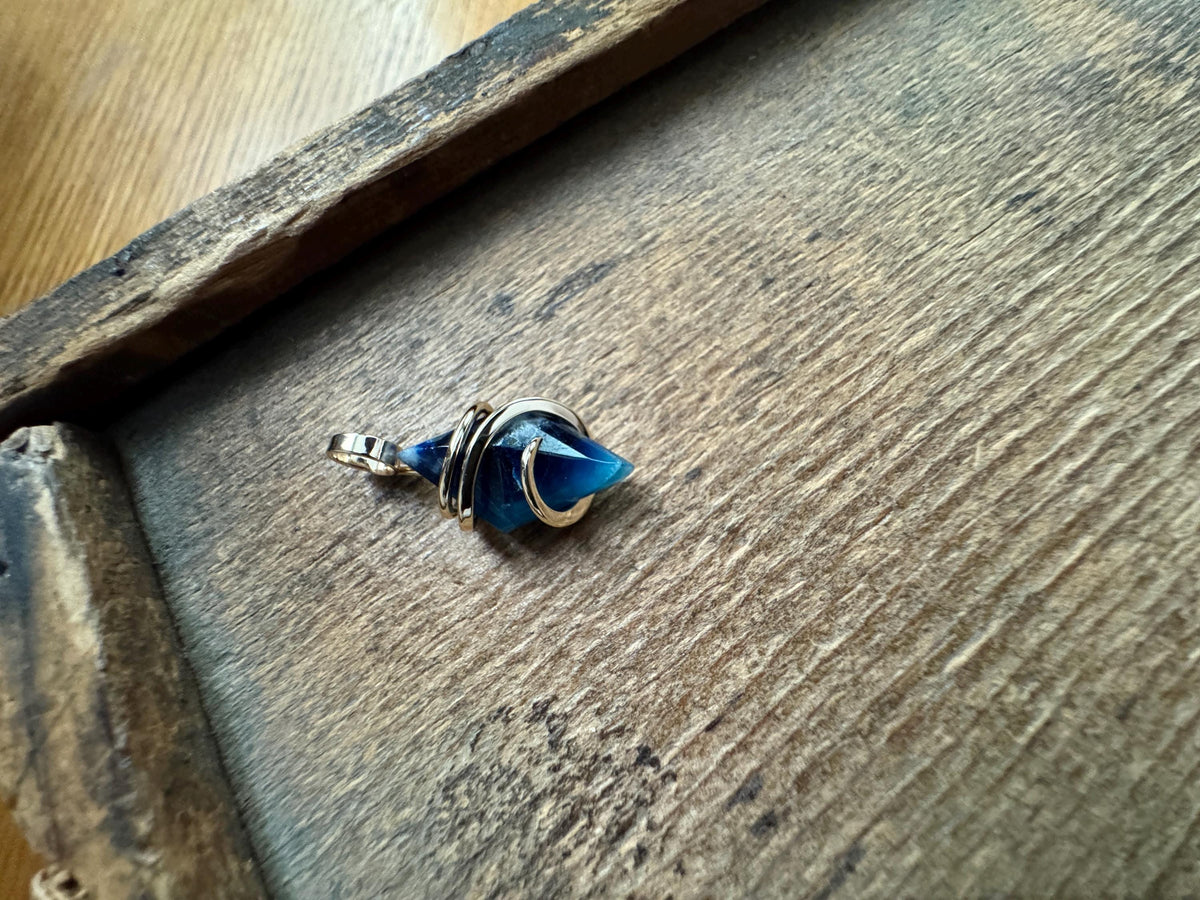 Faceted afghanite in 14k gold pendant