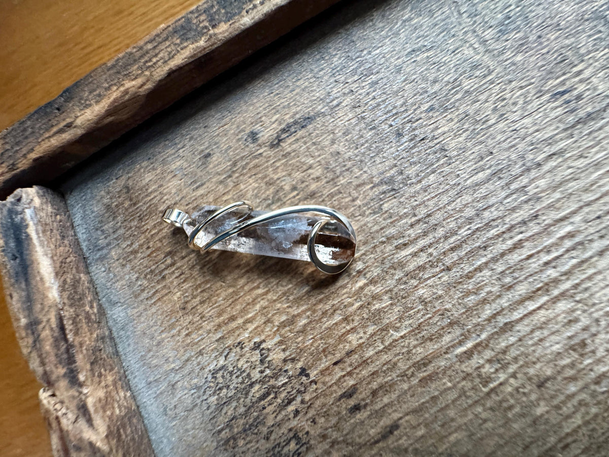 Topaz crystal in 14k gold pendant