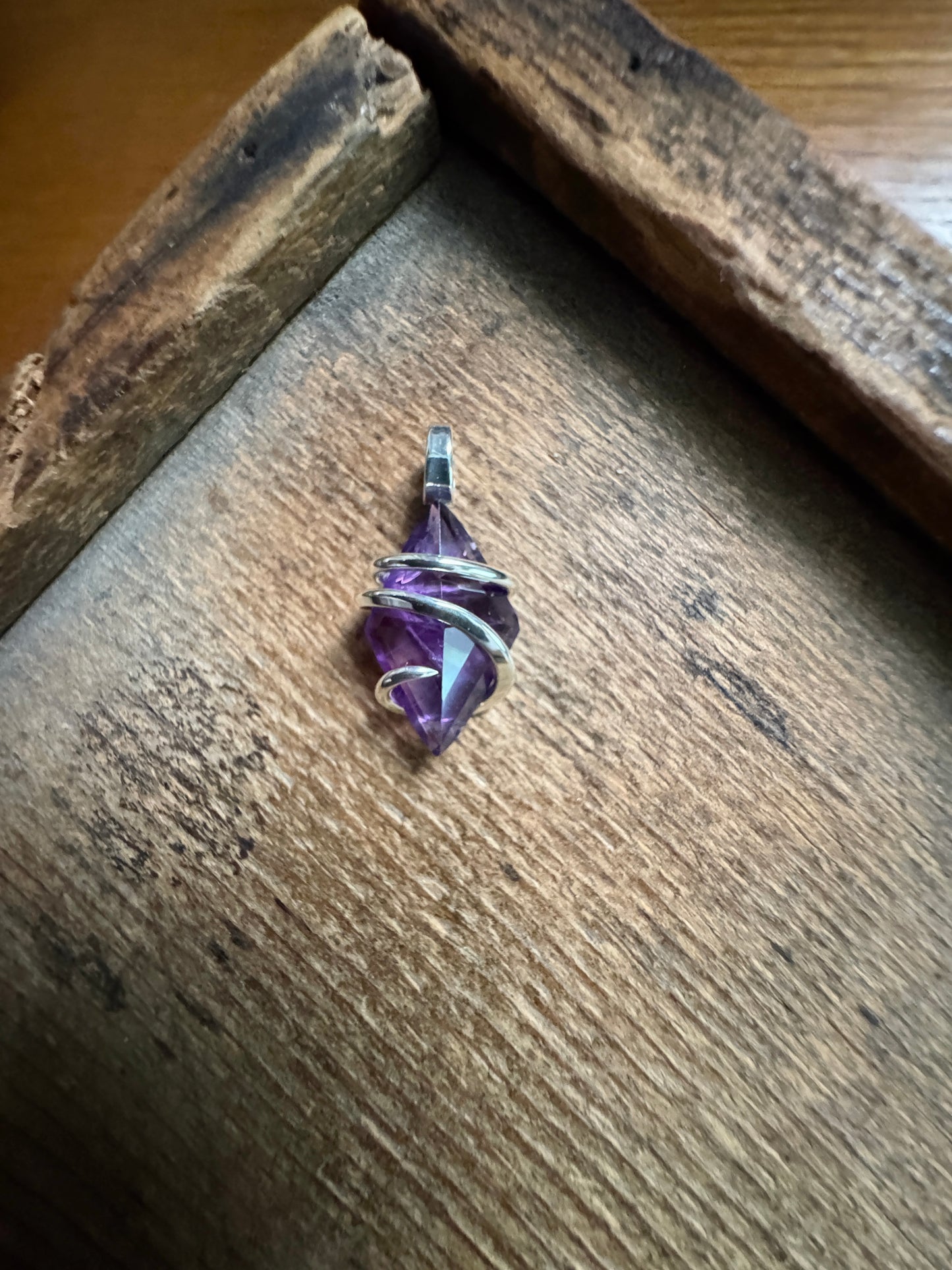 Faceted amethyst in sterling silver pendant