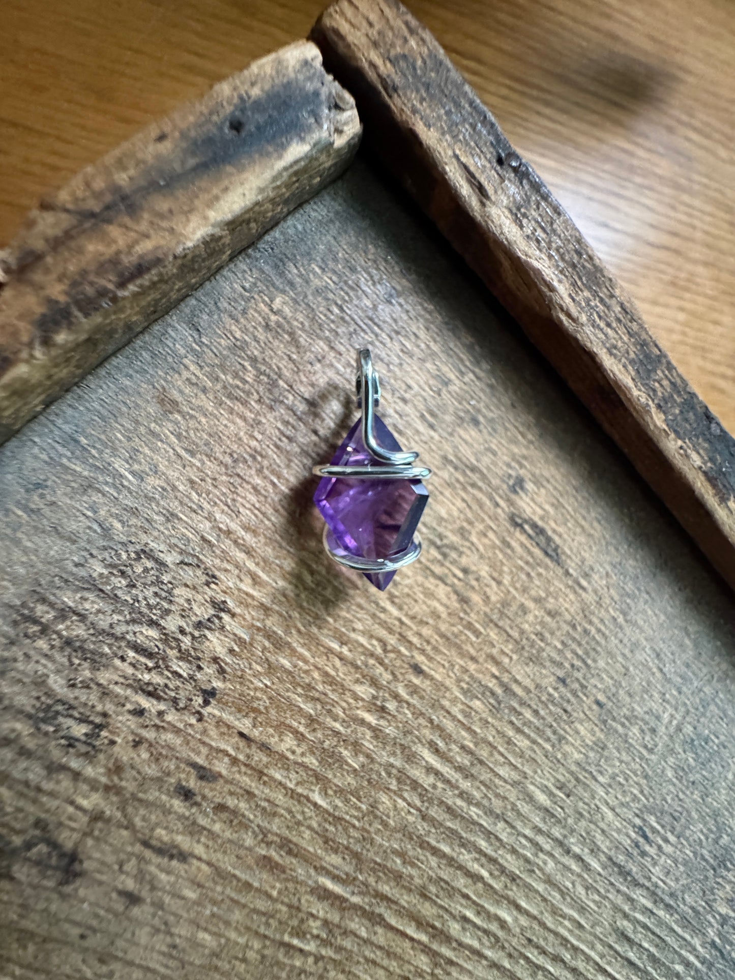 Faceted amethyst in sterling silver pendant