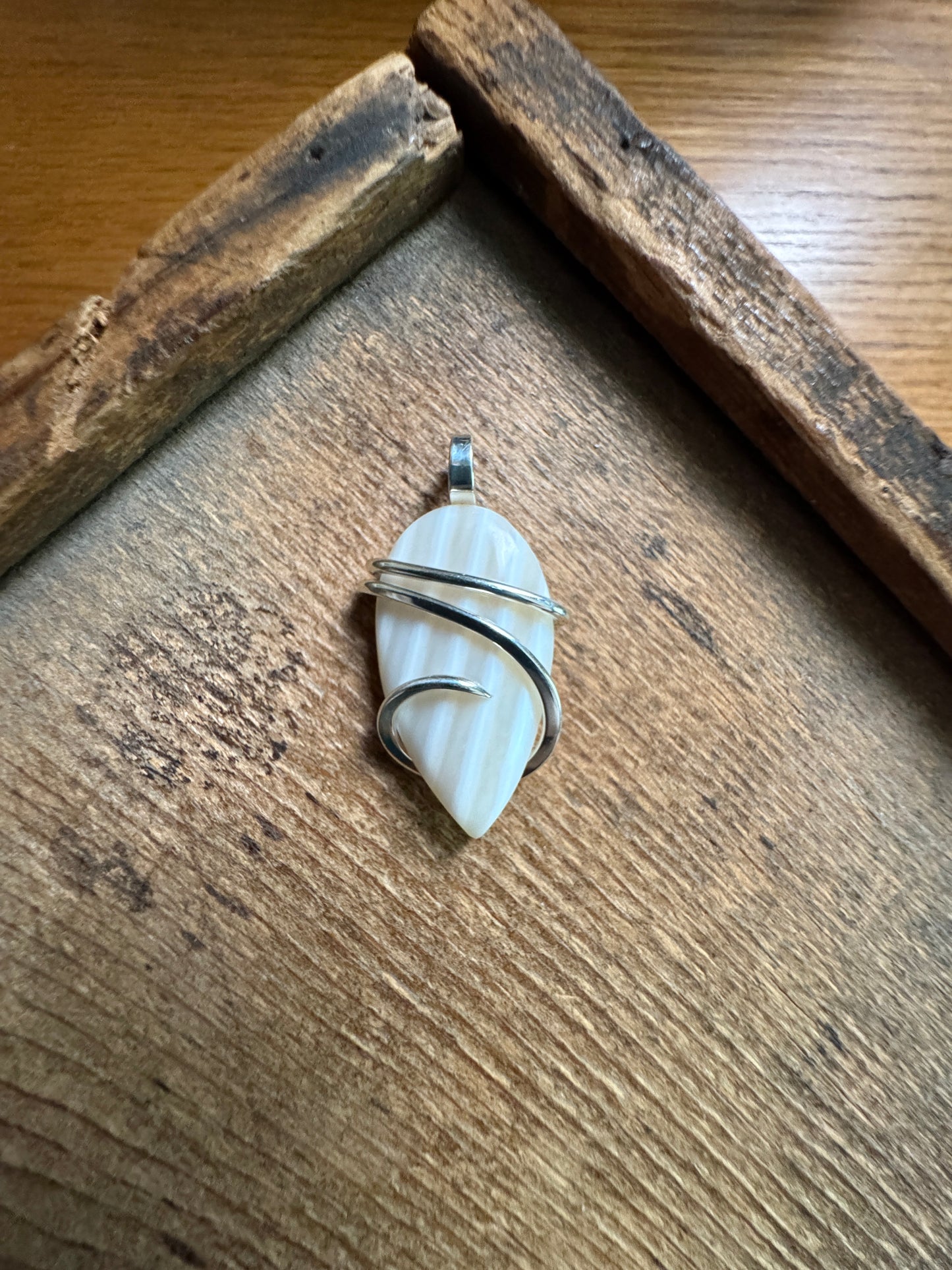Shell in forged sterling silver pendant