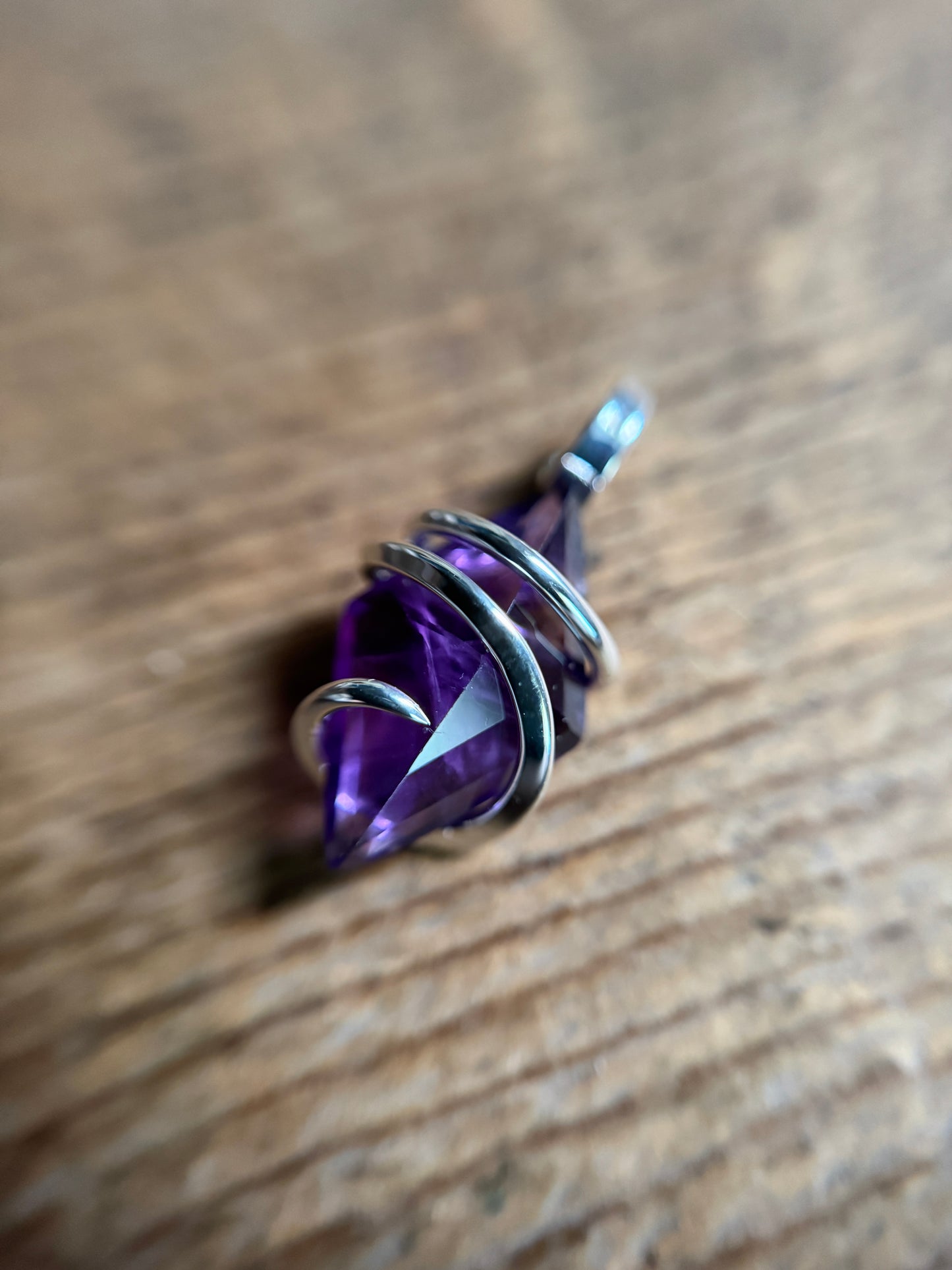Faceted amethyst in sterling silver pendant