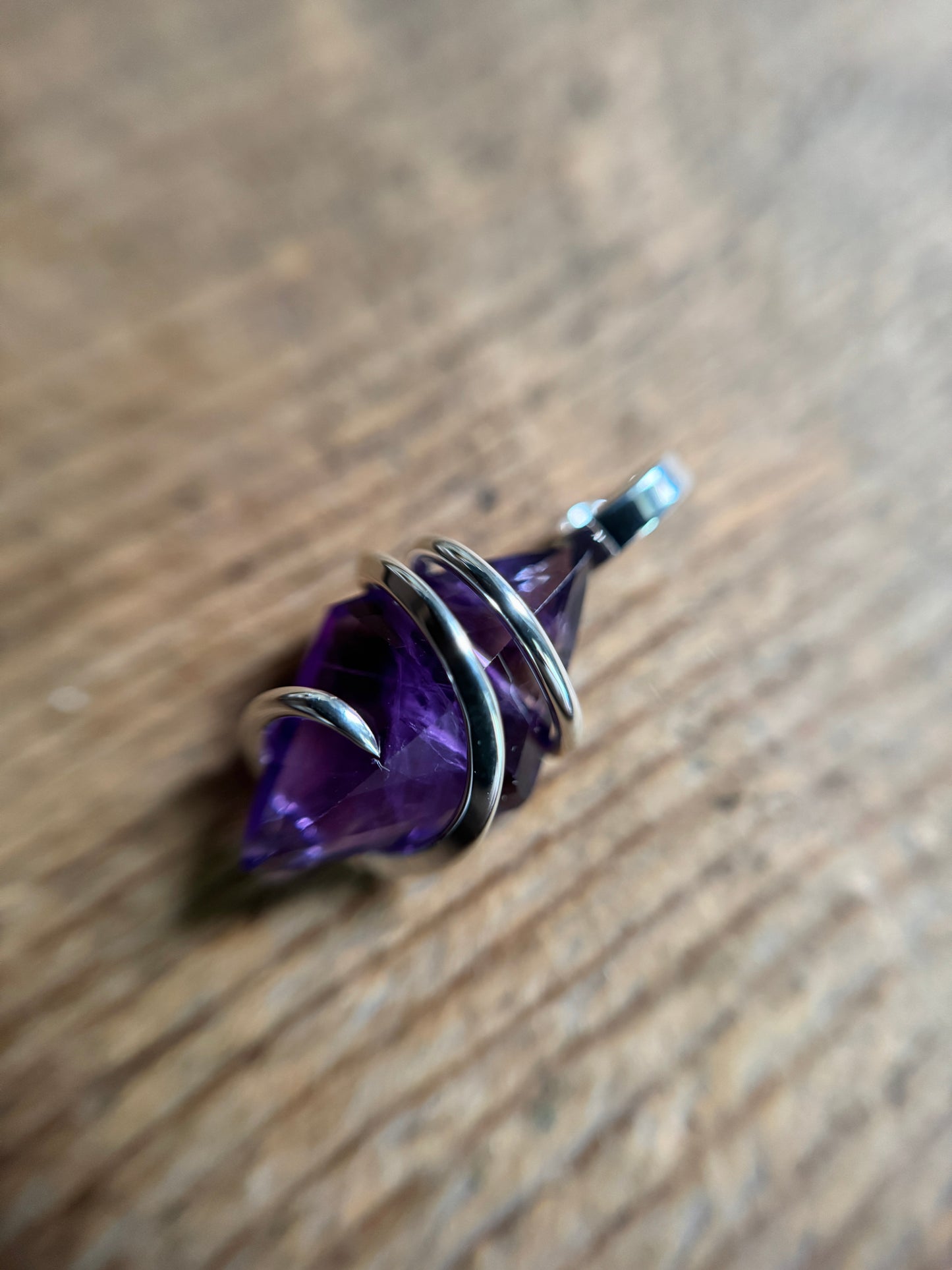 Faceted amethyst in sterling silver pendant